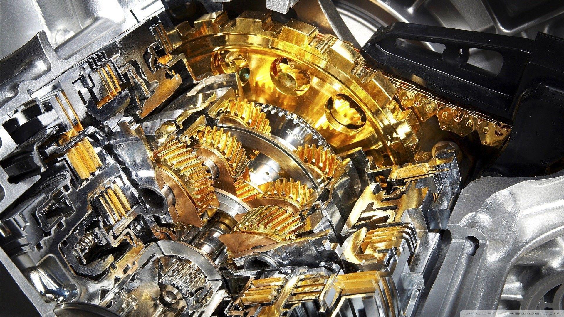 Gold Plated Cogs In The Engine Wallpaper And Image