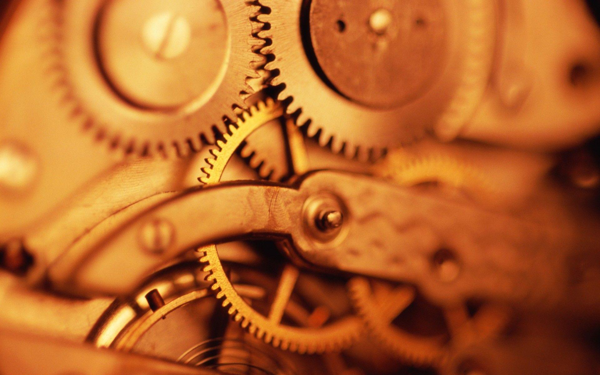 Brass gears in the mechanism wallpaper and image