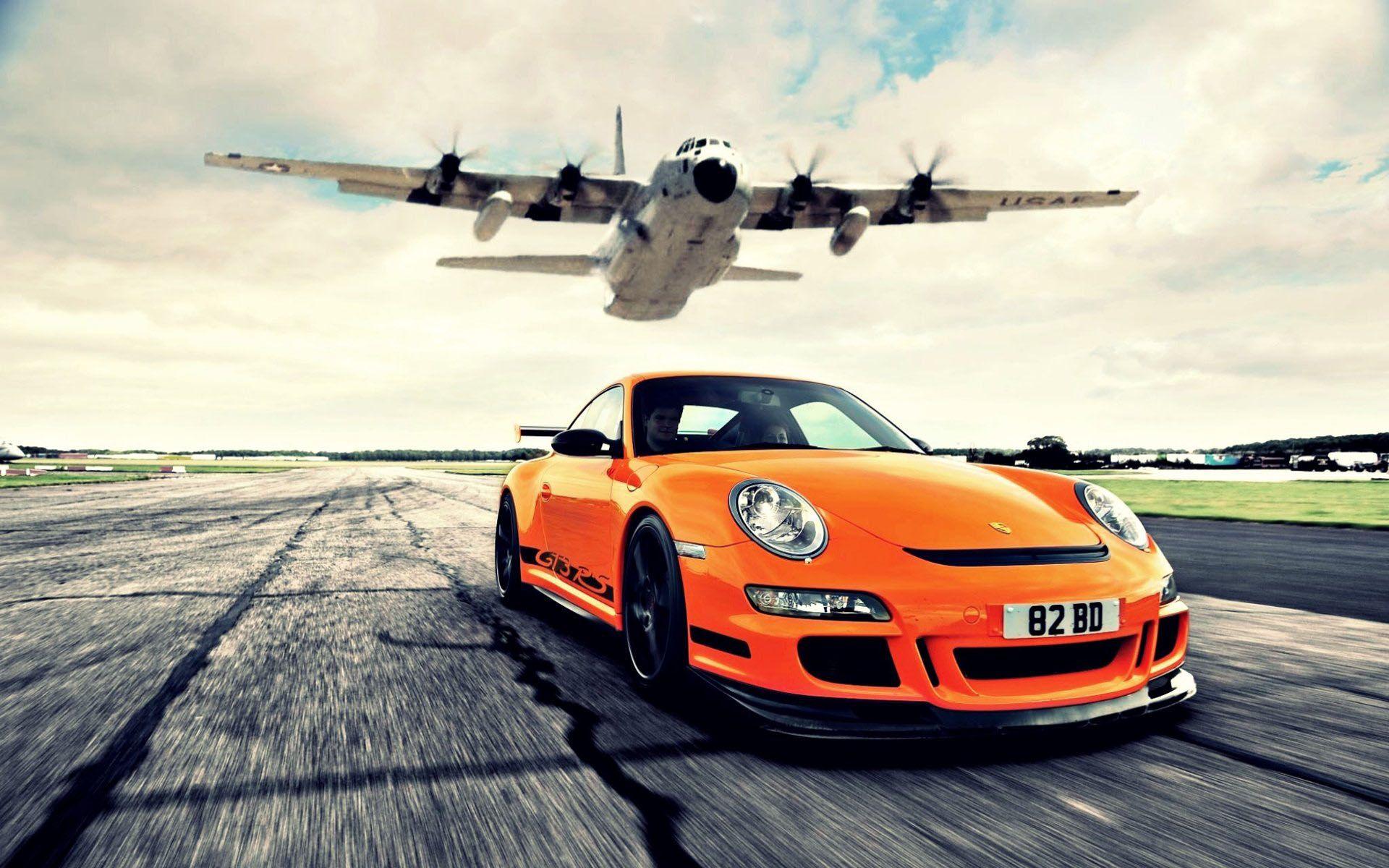 Awesome Orange Porsche 911 Races Againt Lockheed AC 130 Cargo