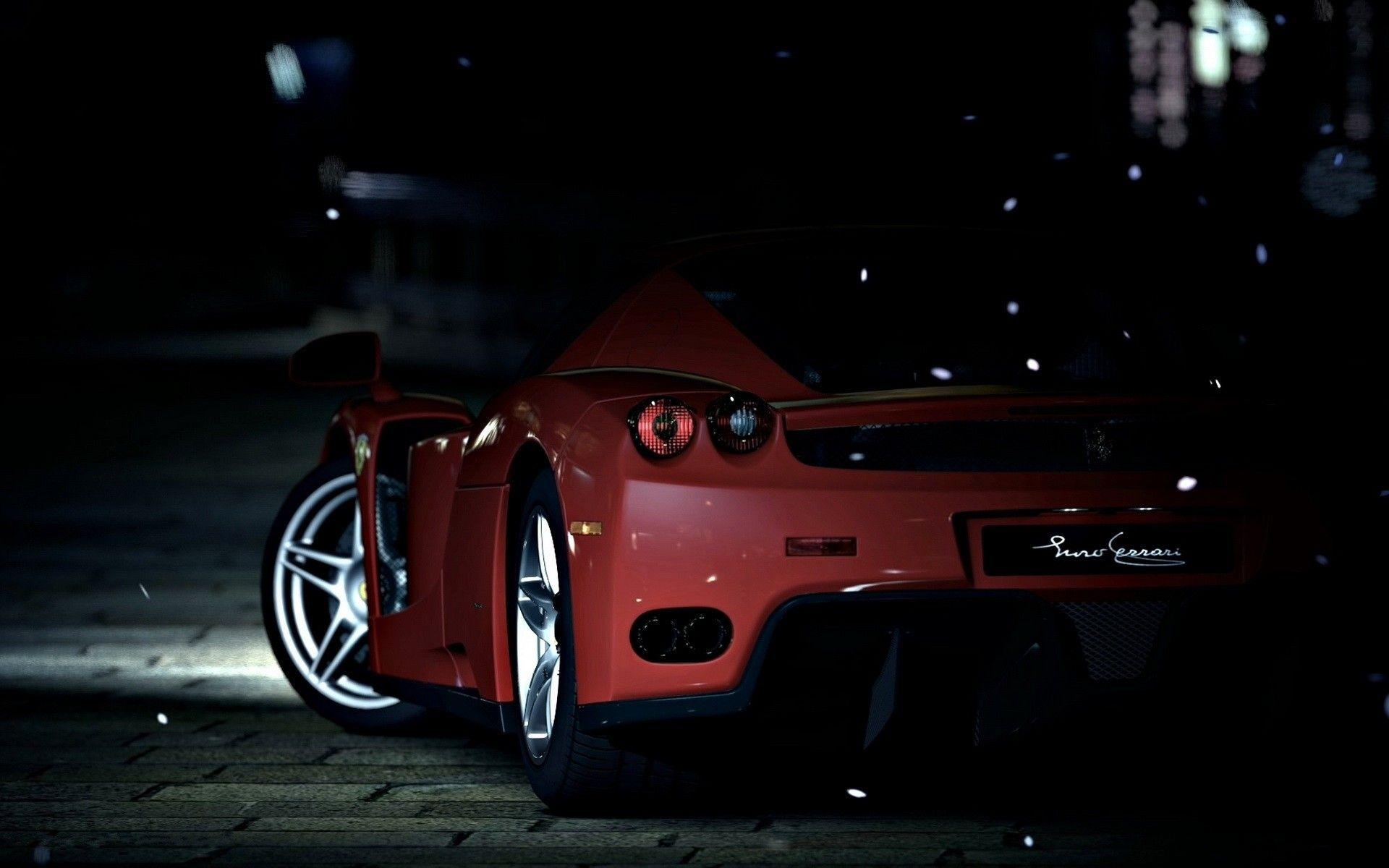 Red sports car on a dark street wallpaper and image