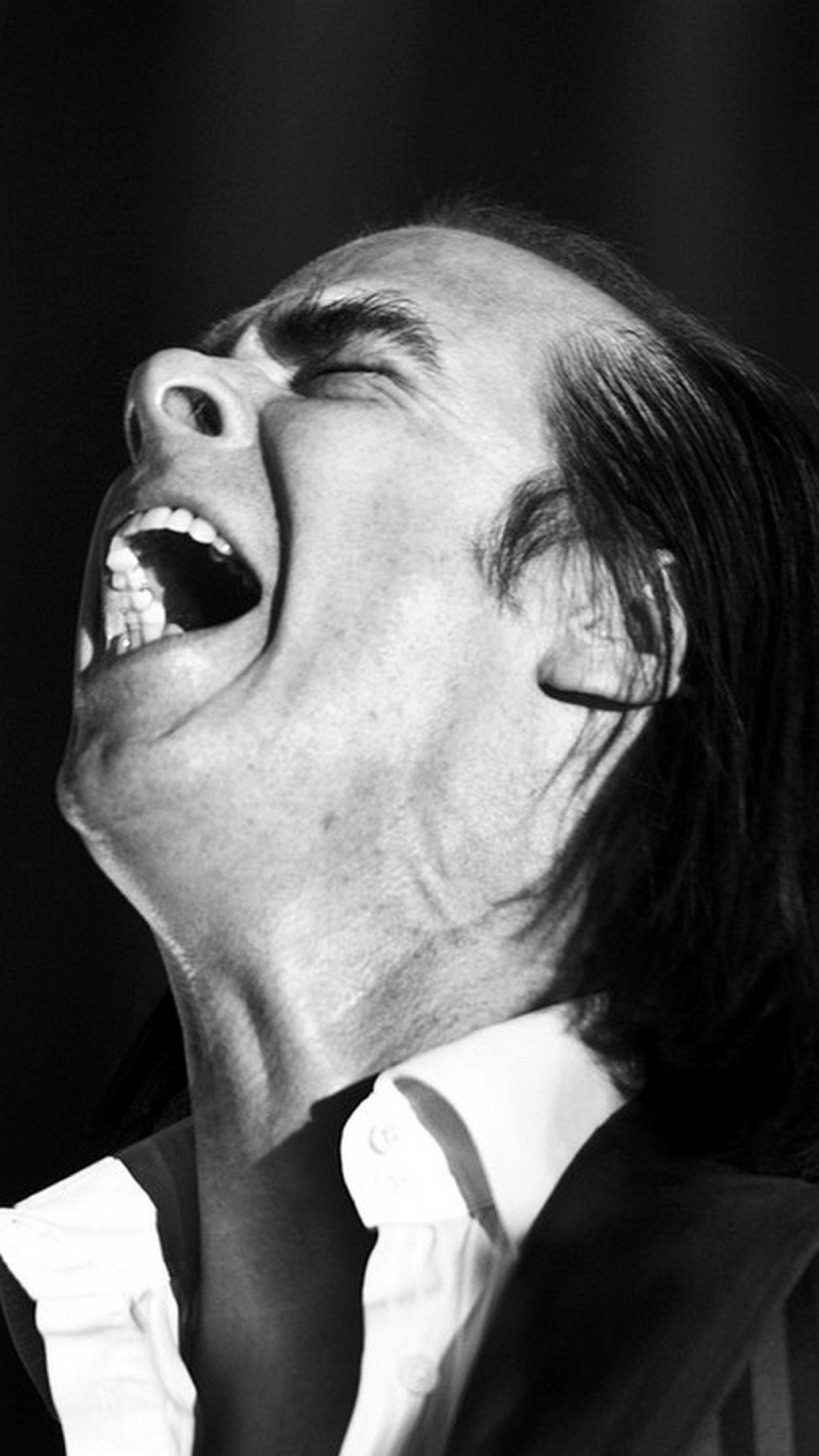 Download Wallpaper 2160x3840 Nick cave, Show, Microphone, Face