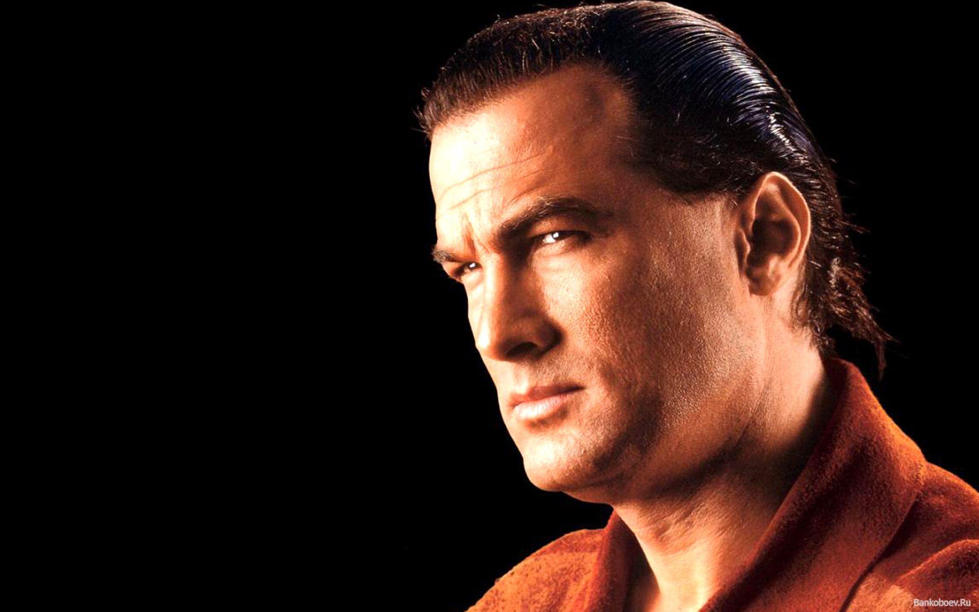 Steven Seagal on dark background wallpaper and image
