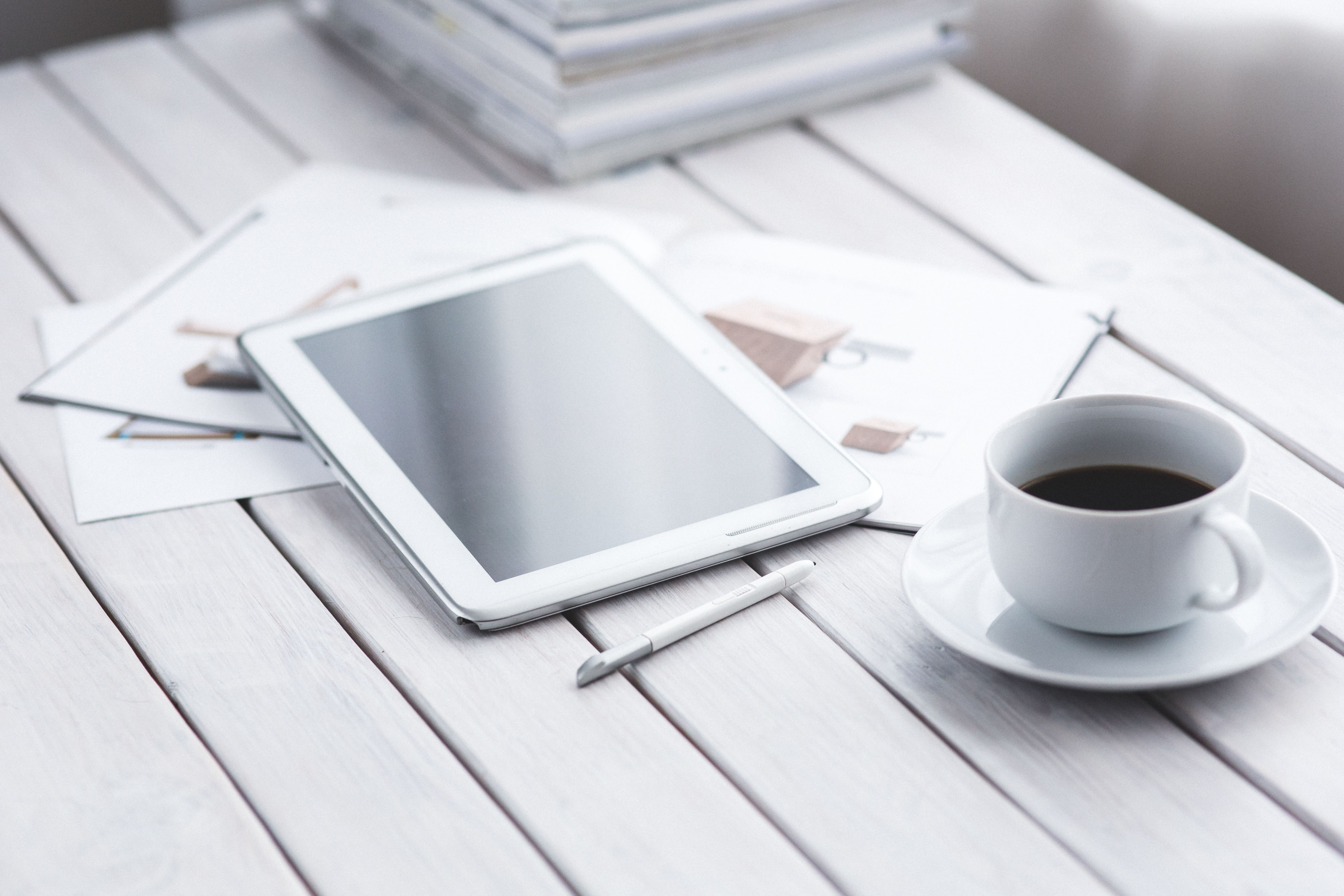 White tablet and cup of coffee · Free
