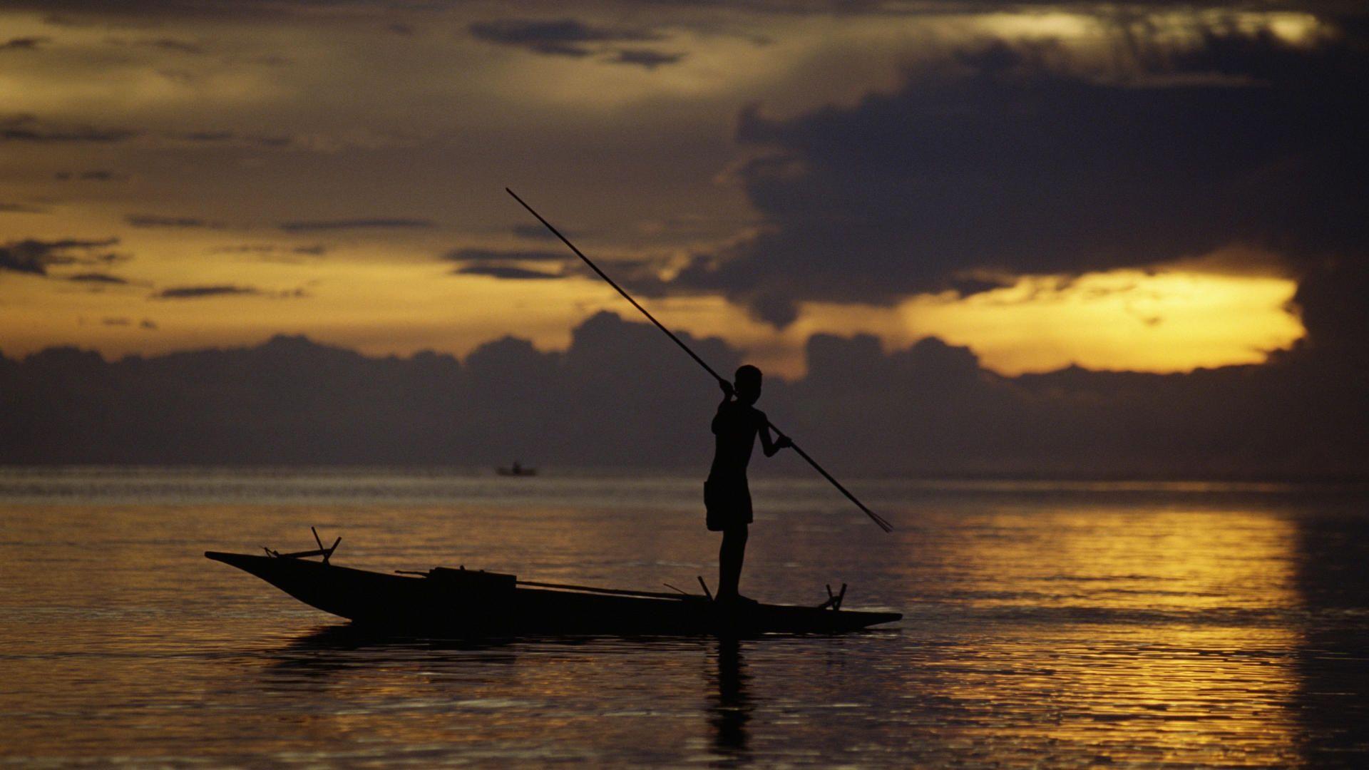 Nature: Fisherman At Sunset, Fergusson's Island, Papua New Guinea