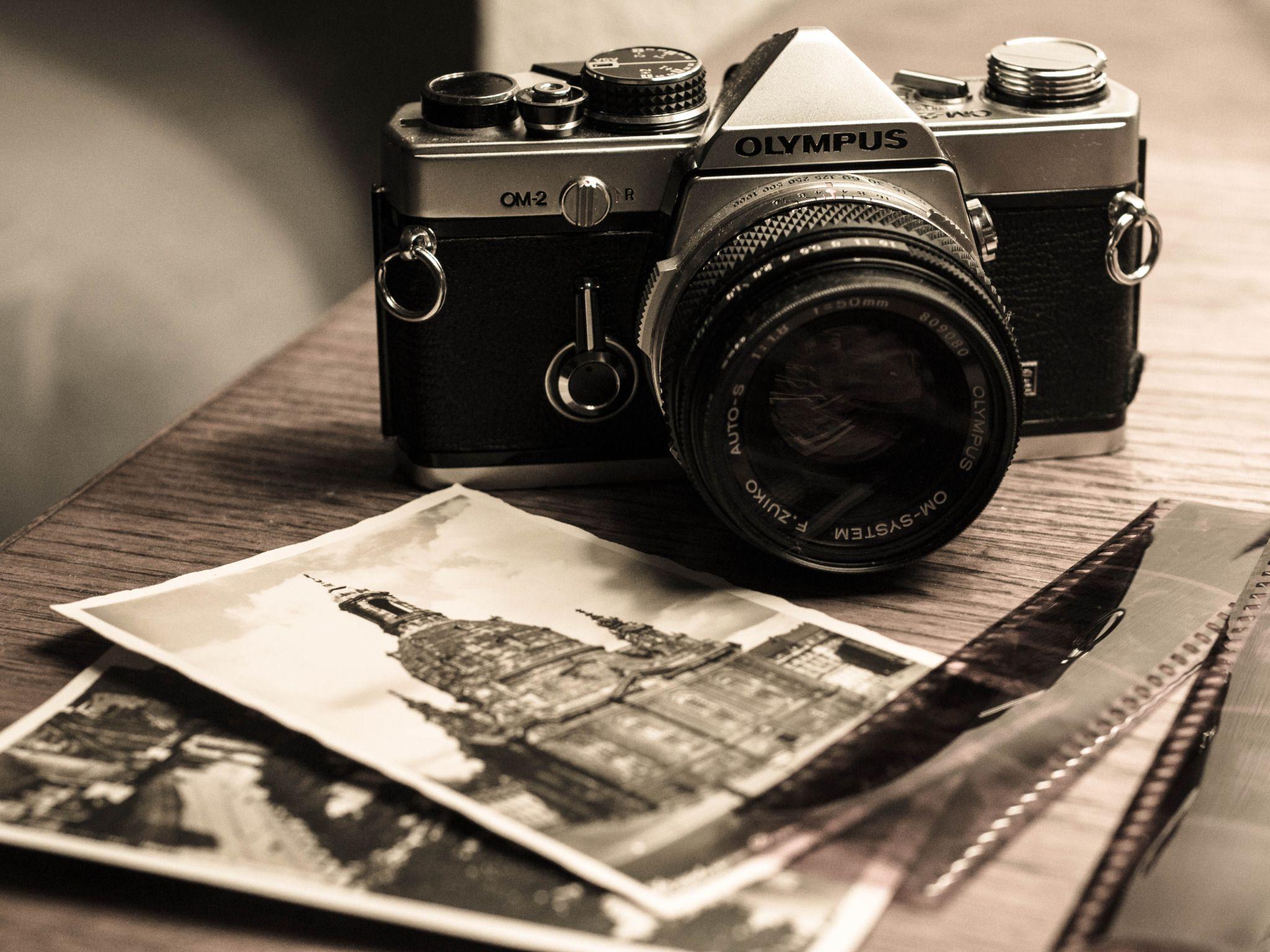 Vintage Olympus OM 2 Camera And Photographs Widescreen Wallpaper