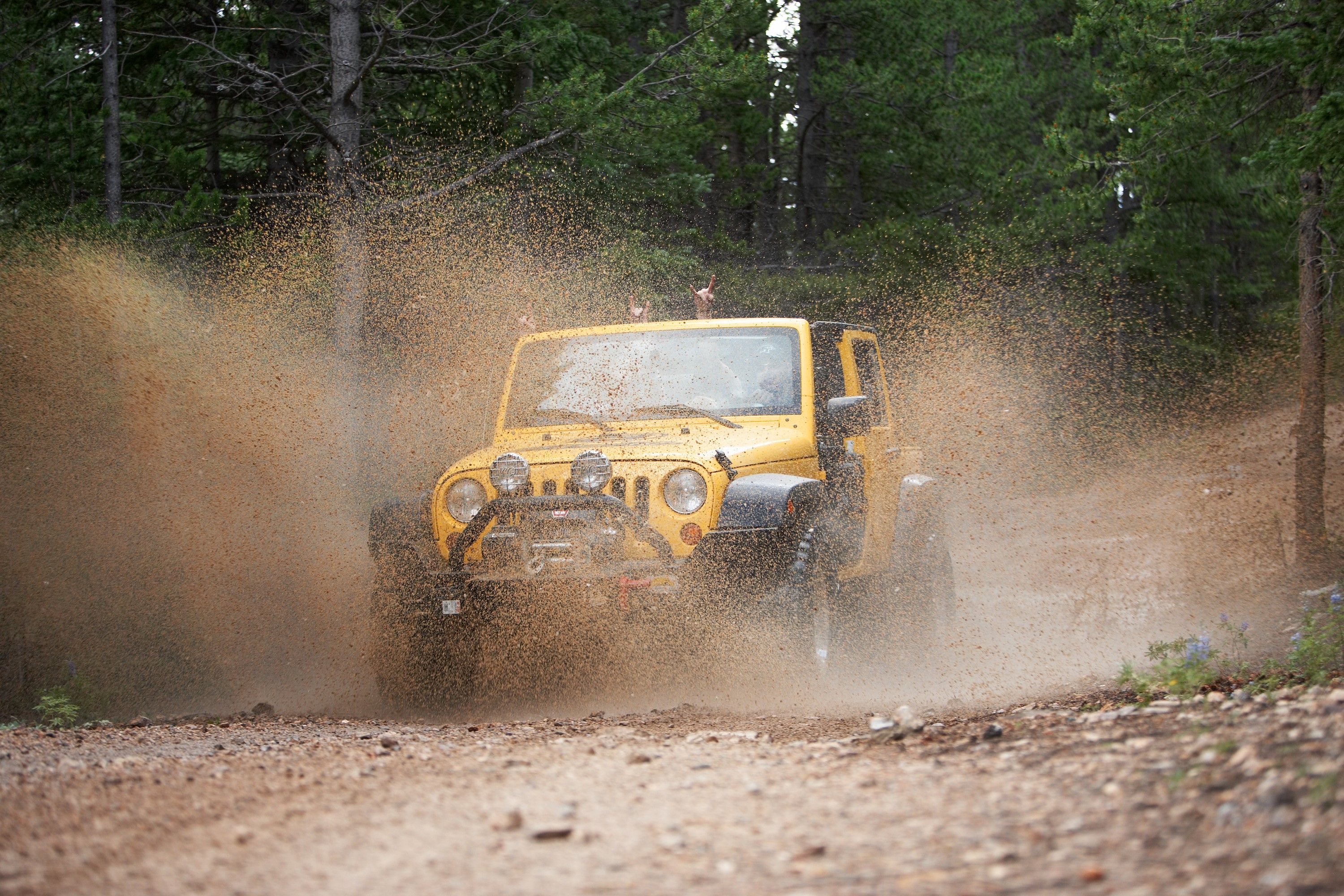 Yellow Jeep Mudding with Hands