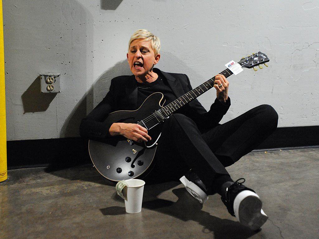 Ellen DeGeneres playing guitar