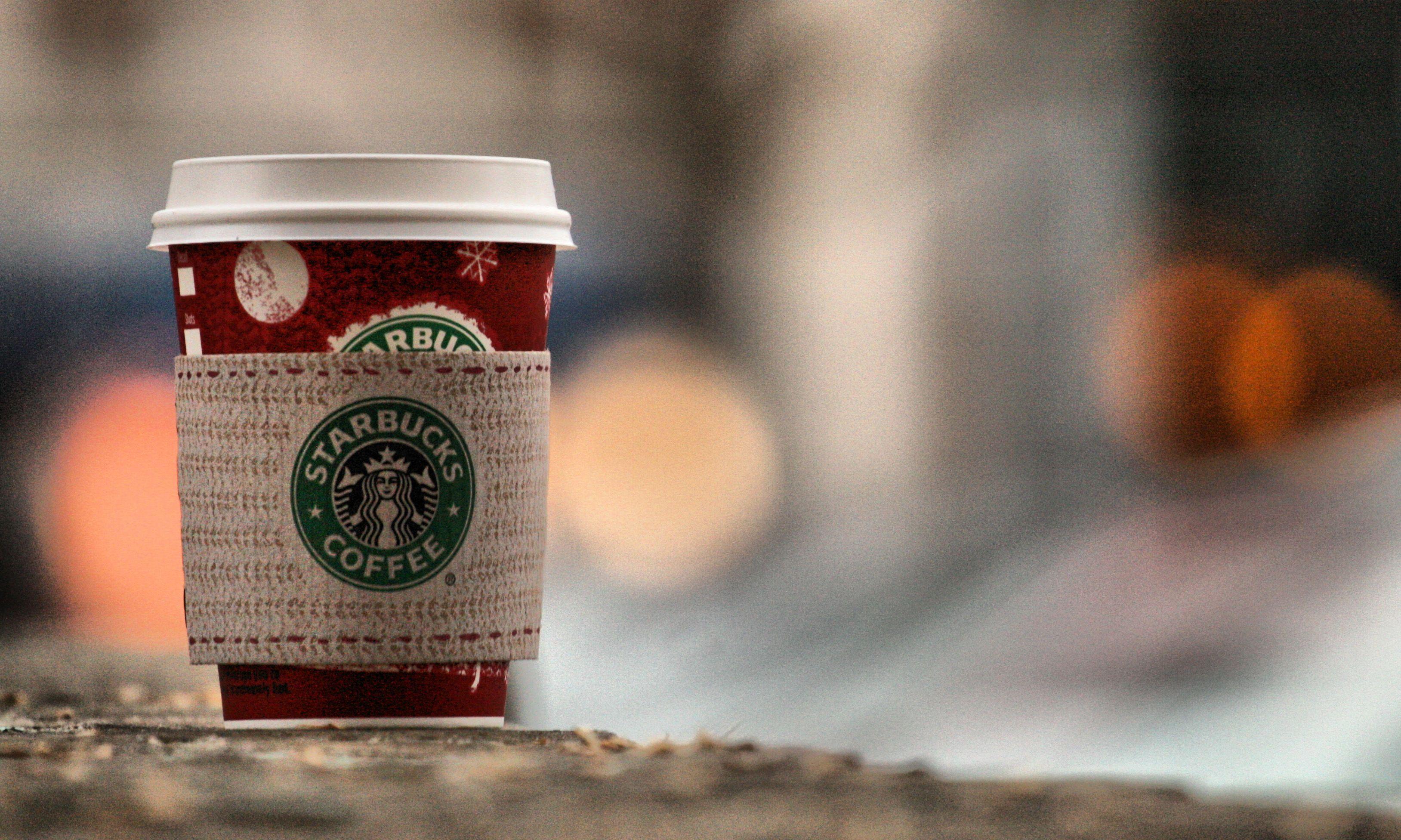 Artistic Starbucks Coffee Cup Wallpaper in Close Up with Blur Effect