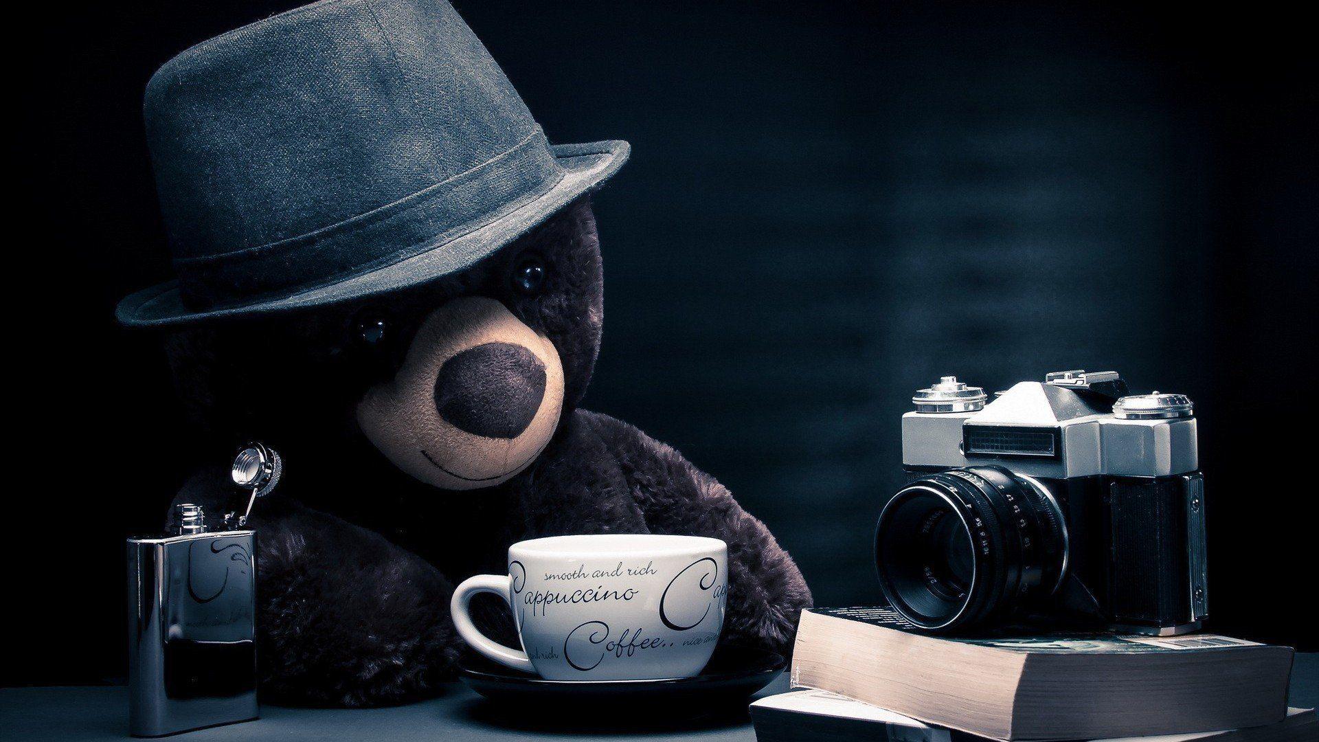 teddy bear books camera hat journalist cappuccino coffee table