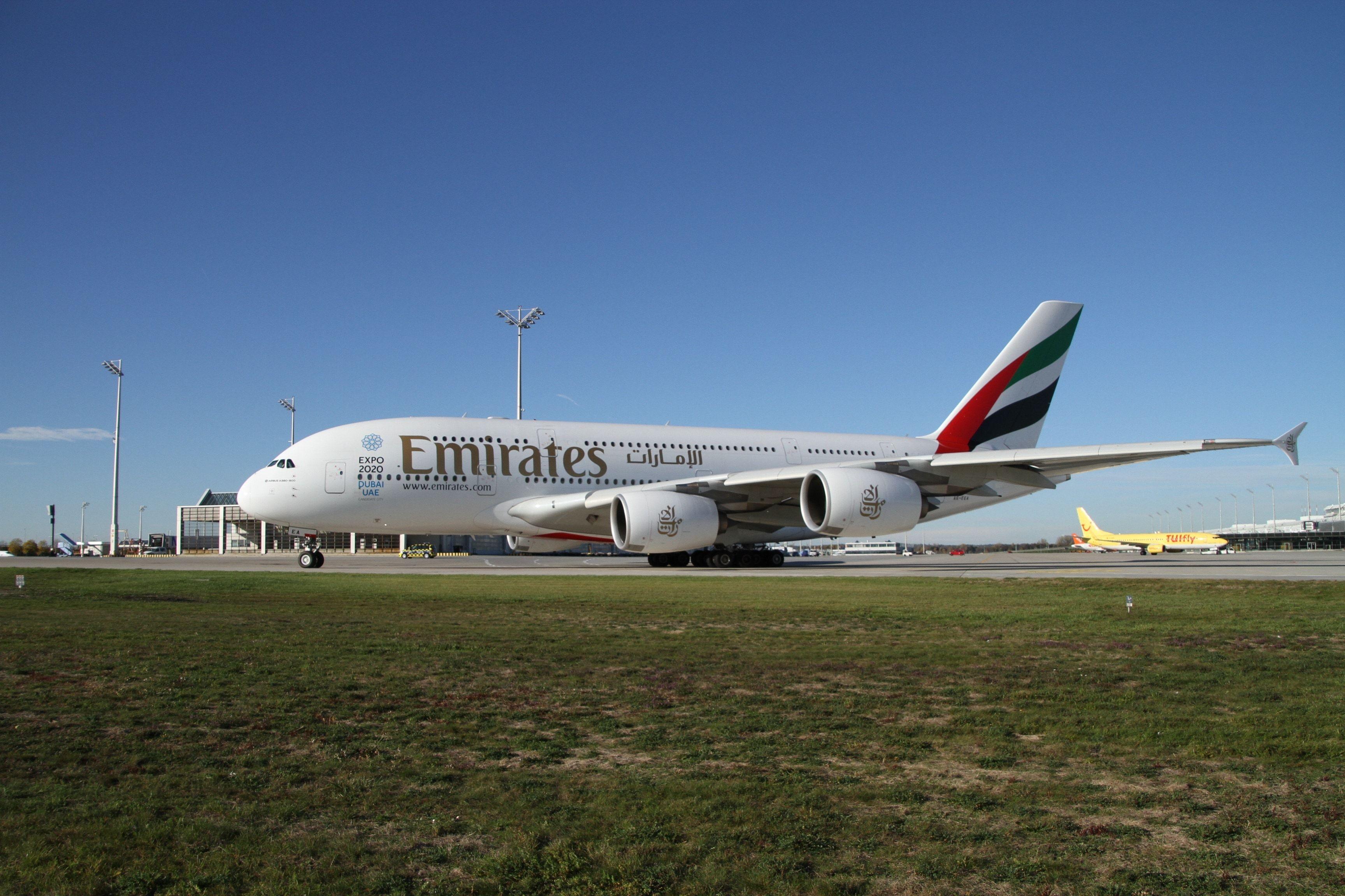 white emirates airplane and airport free image