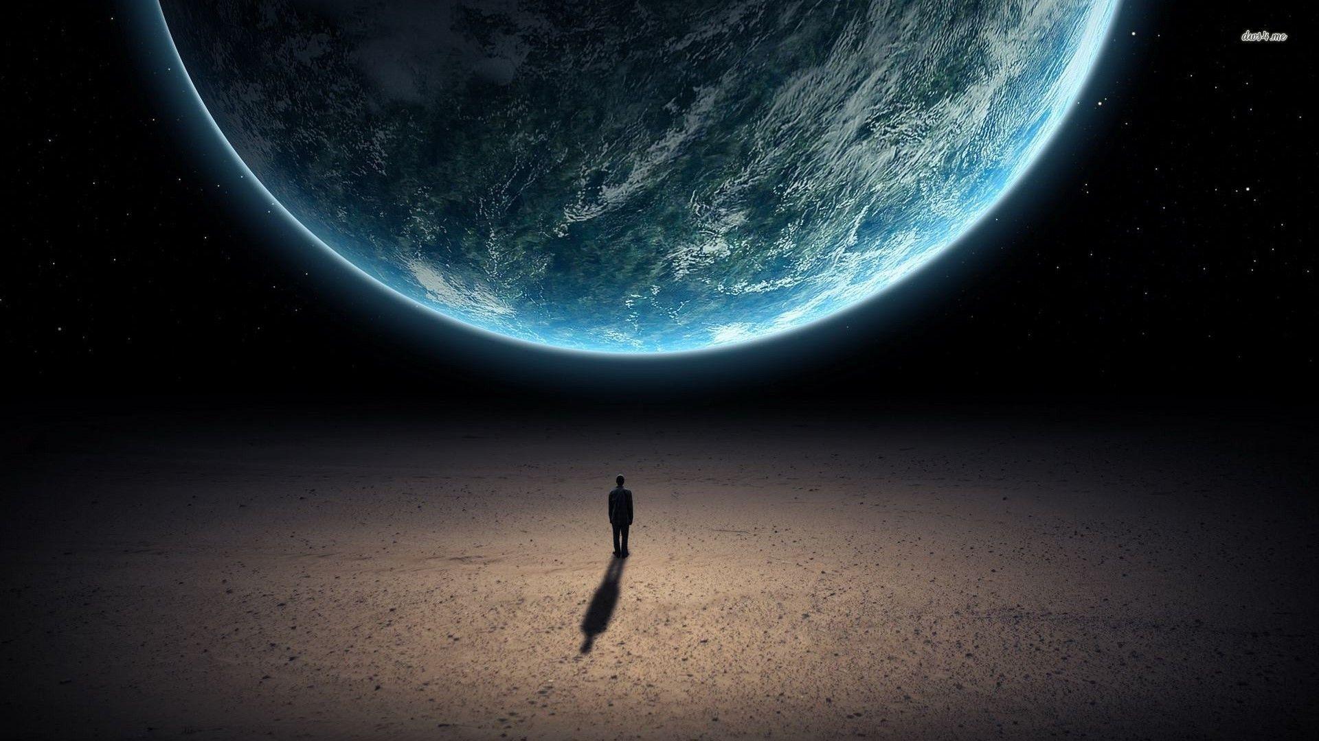 Man looking at Earth from space wallpaper wallpaper