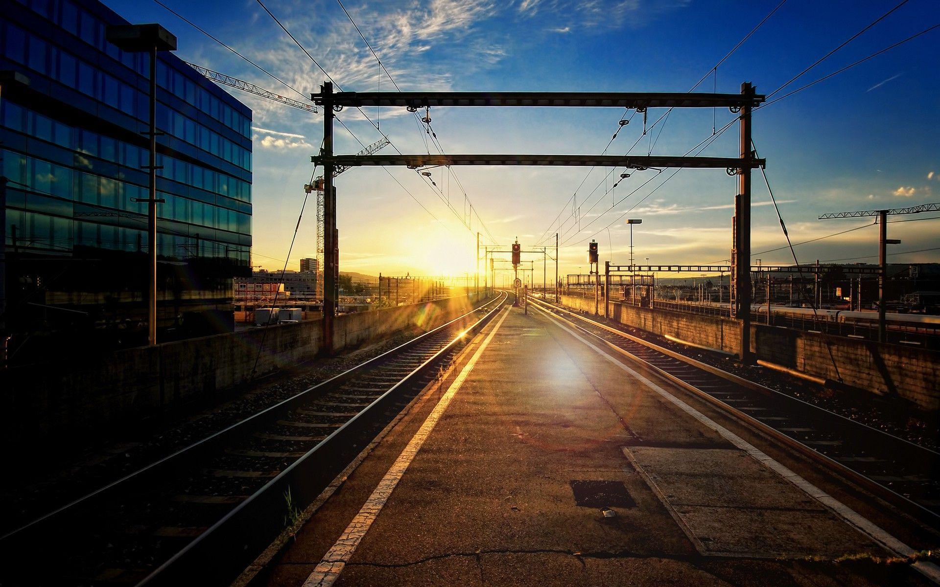 Sunset light over railroad tracks Wallpaper