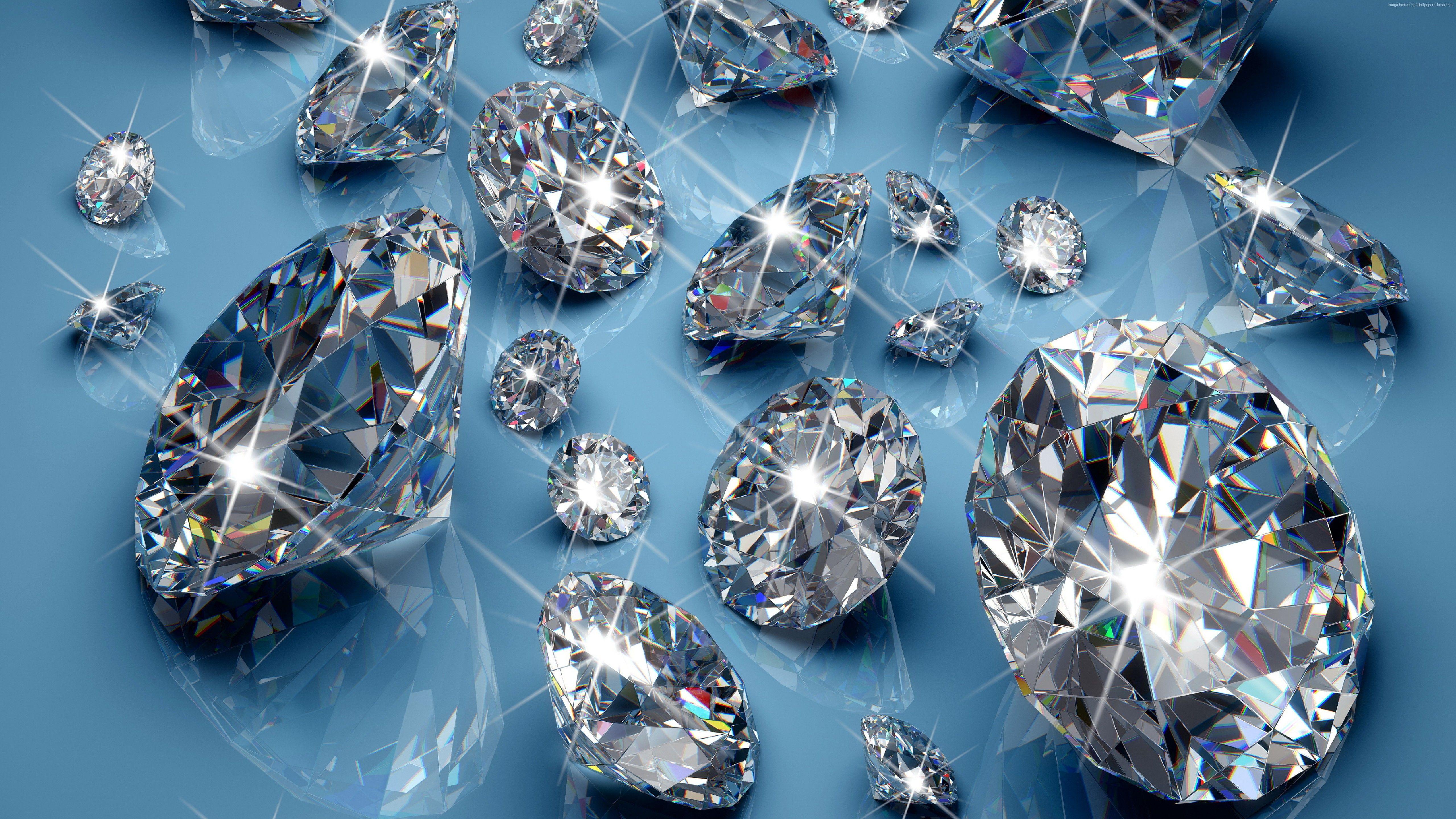 Bright gemstones diamonds on a blue background wallpaper