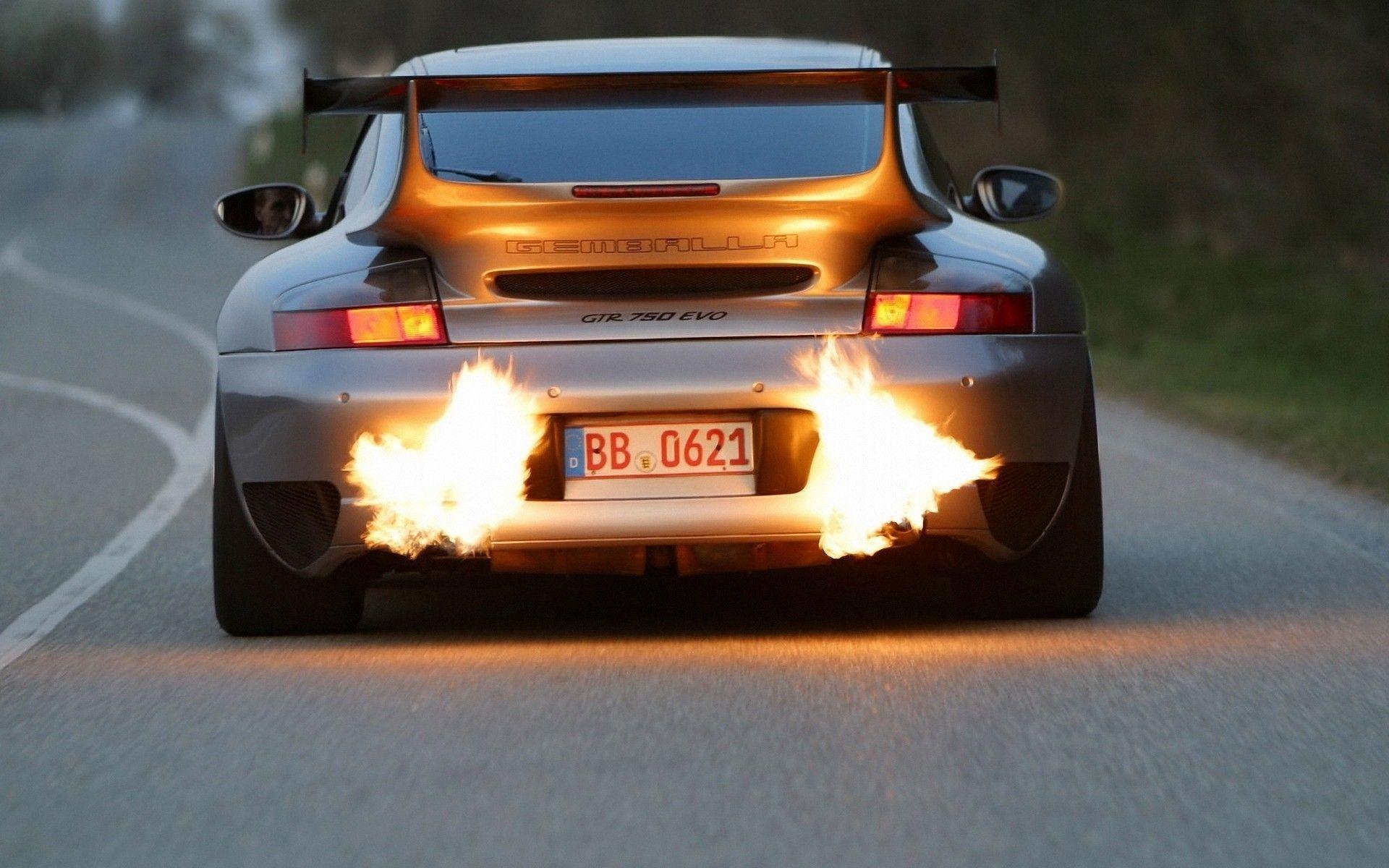 Flames from the exhaust of a Porsche wallpaper and image