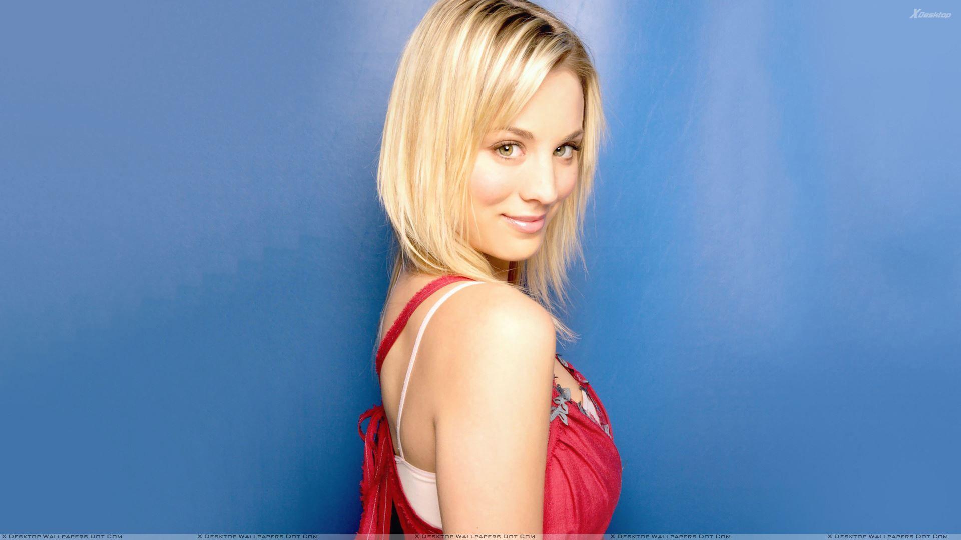 Kaley Cuoco Smiling Side Pose N Blue Backgrounds Wallpapers