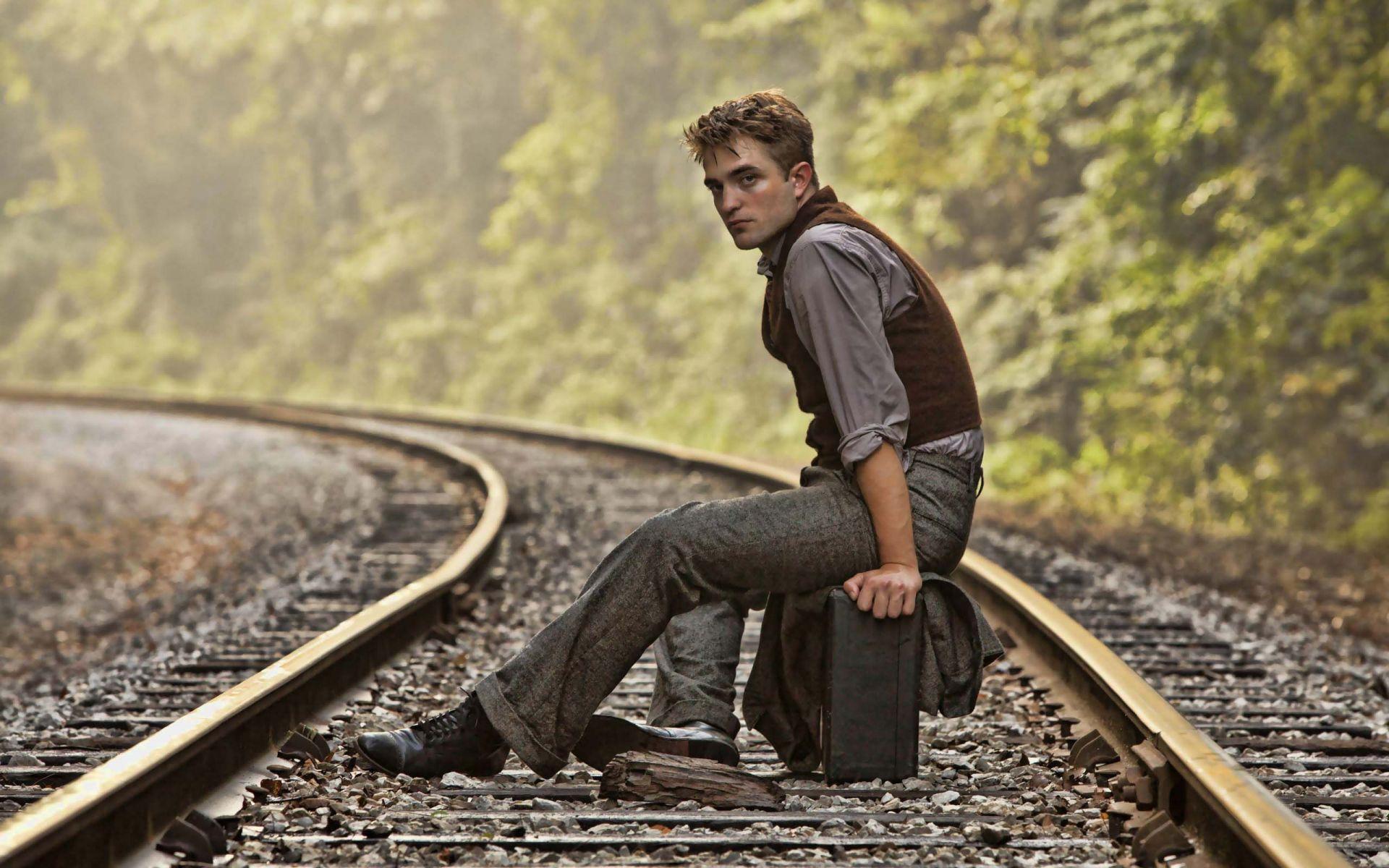 Robert Pattinson Sitting on a Railway Track. HD Hollywood Actors
