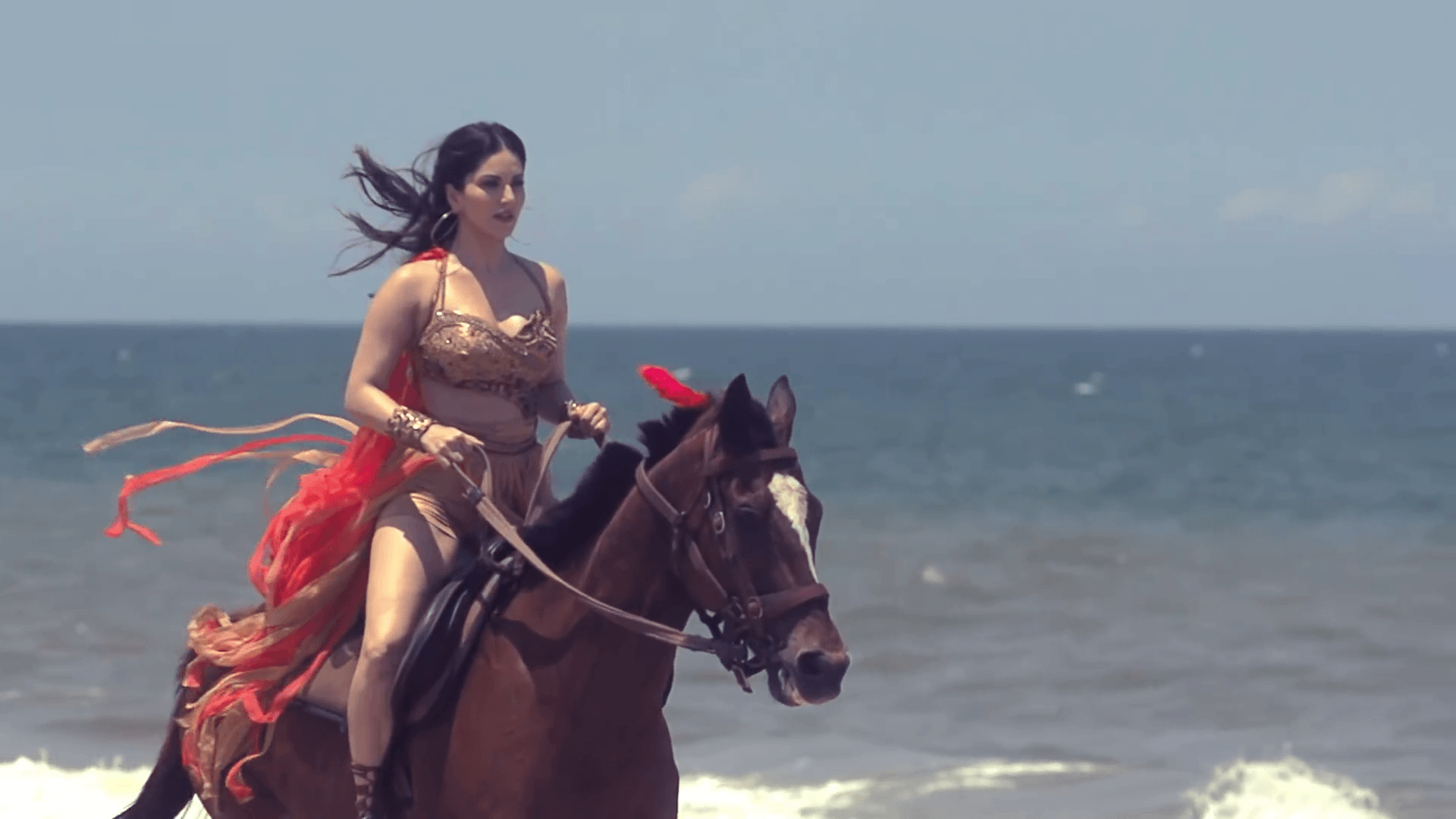 Sunny Leone Horse Riding at Beach Wallpapers.