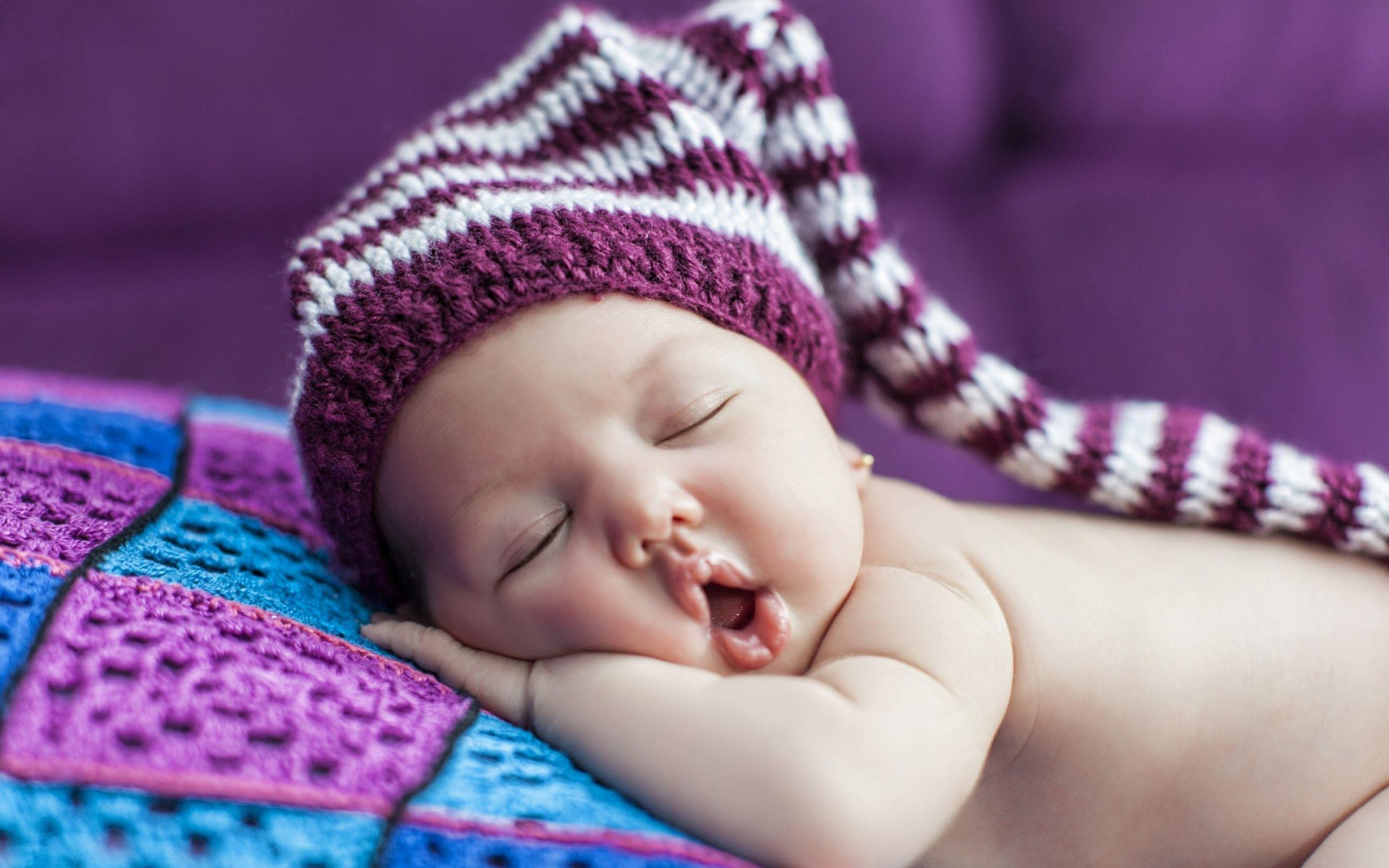 Cute Newborn Baby Sleeps In A Hat Wallpaper