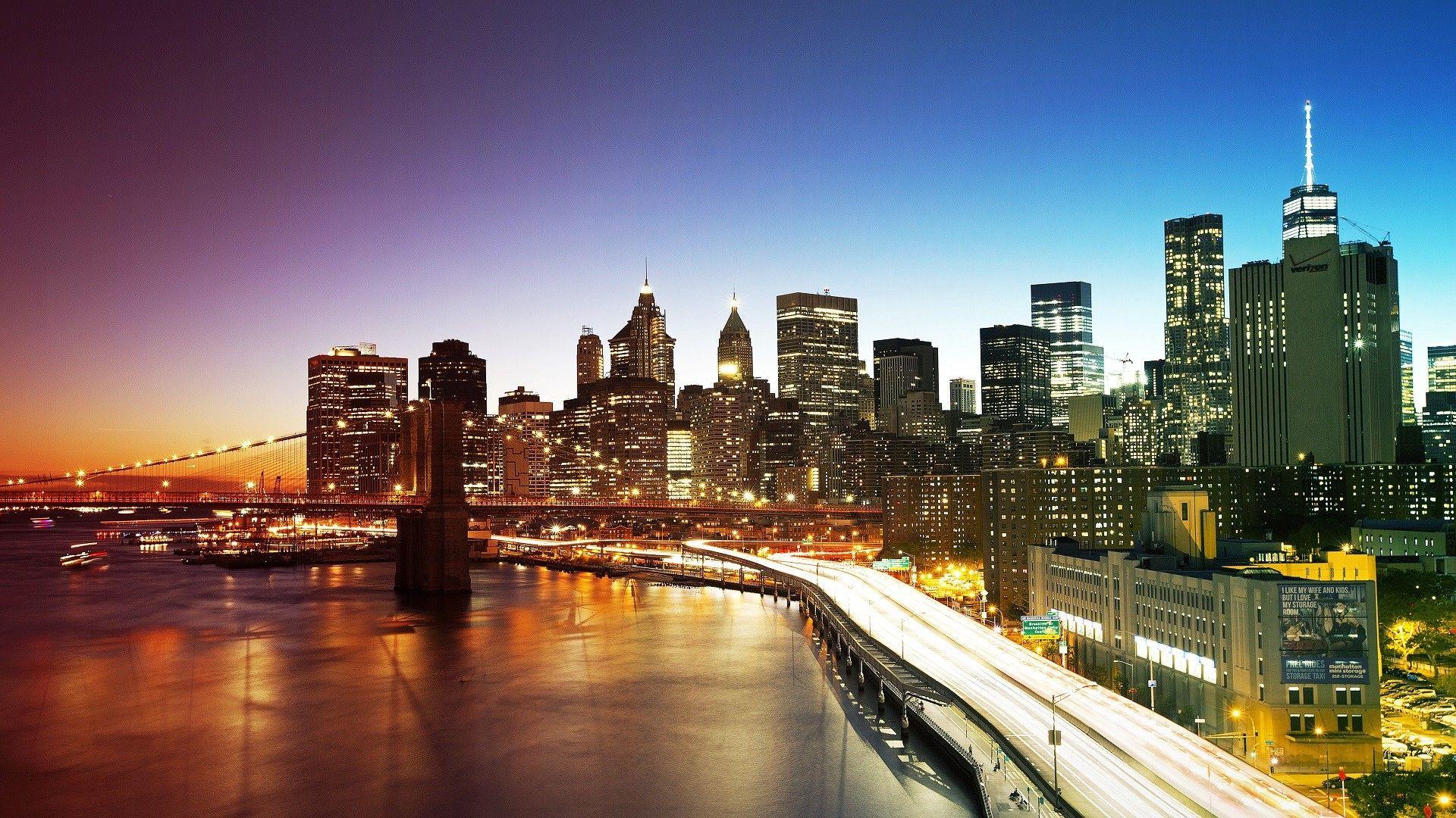 Brooklyn Bridge and the night lights of New York City wallpaper