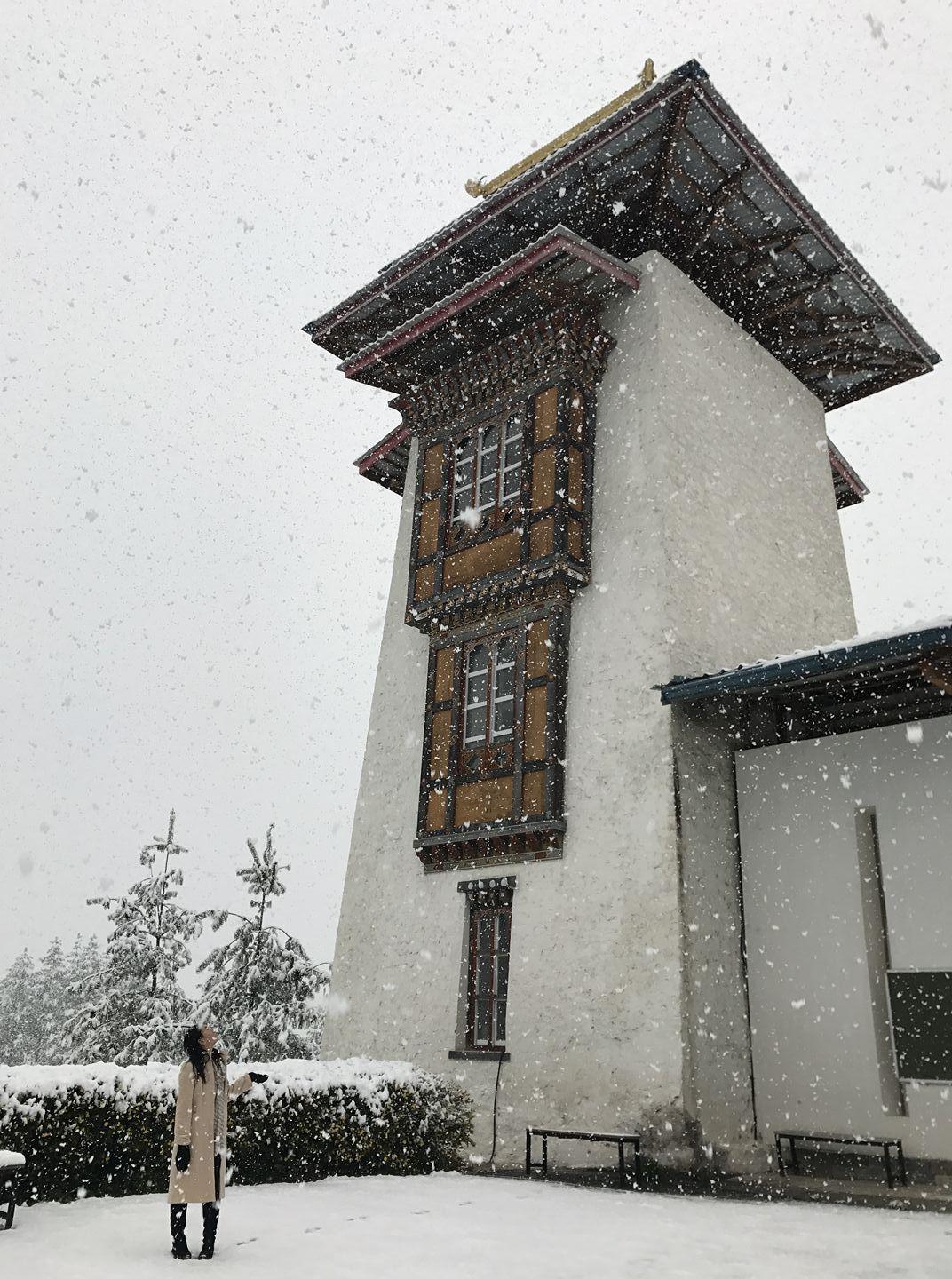A Bhutanese student enjoying the first snowfall of 2017