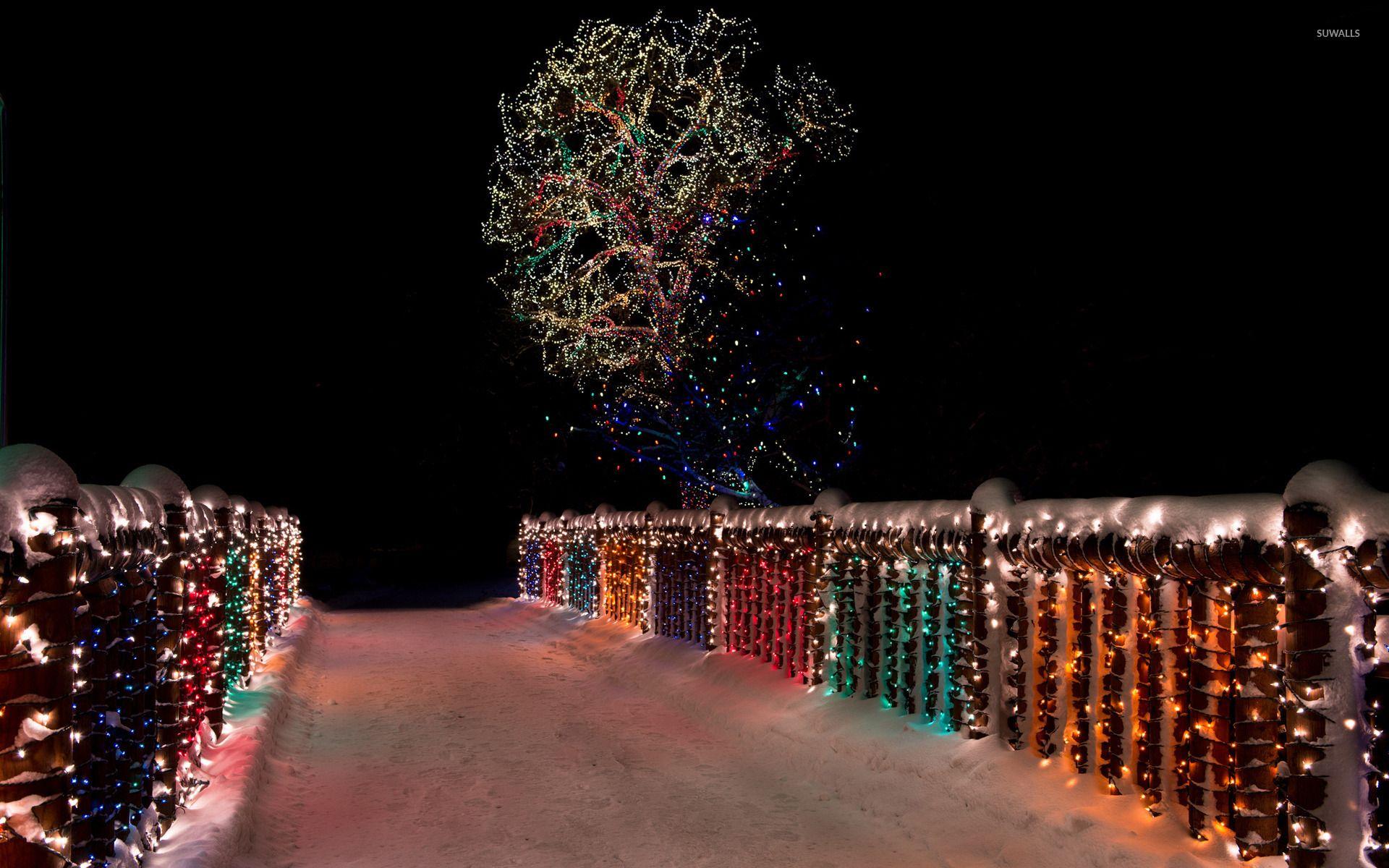 Colorful Christmas lights on the snowy bridge wallpaper wallpaper