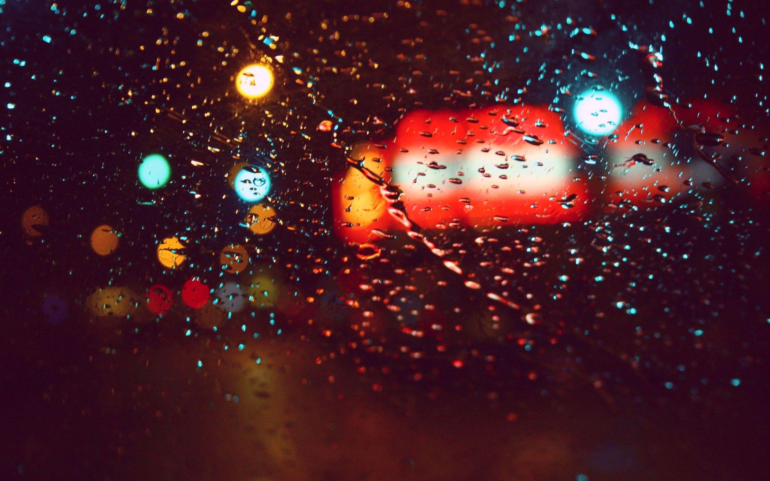 Lights rain cars glass water droplets macro rain on glass