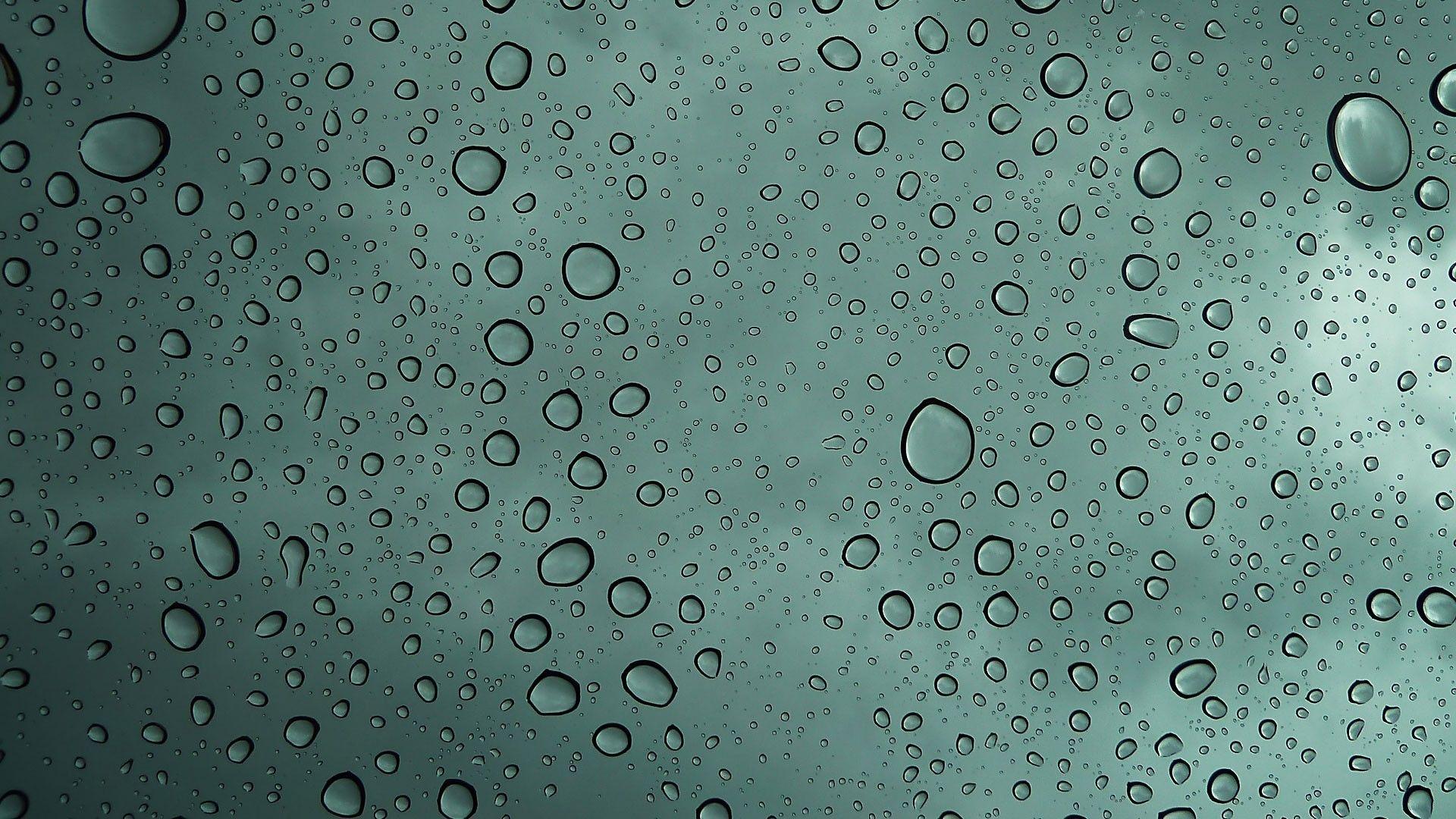 Glass with Water Drops. Macro Photo and Wallpaper