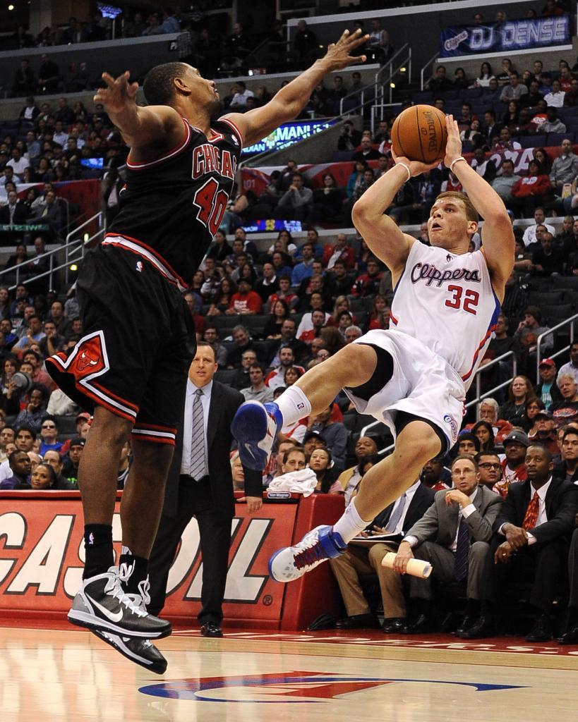 Los Angeles Clippers' forward Blake Griffin shoots falling down