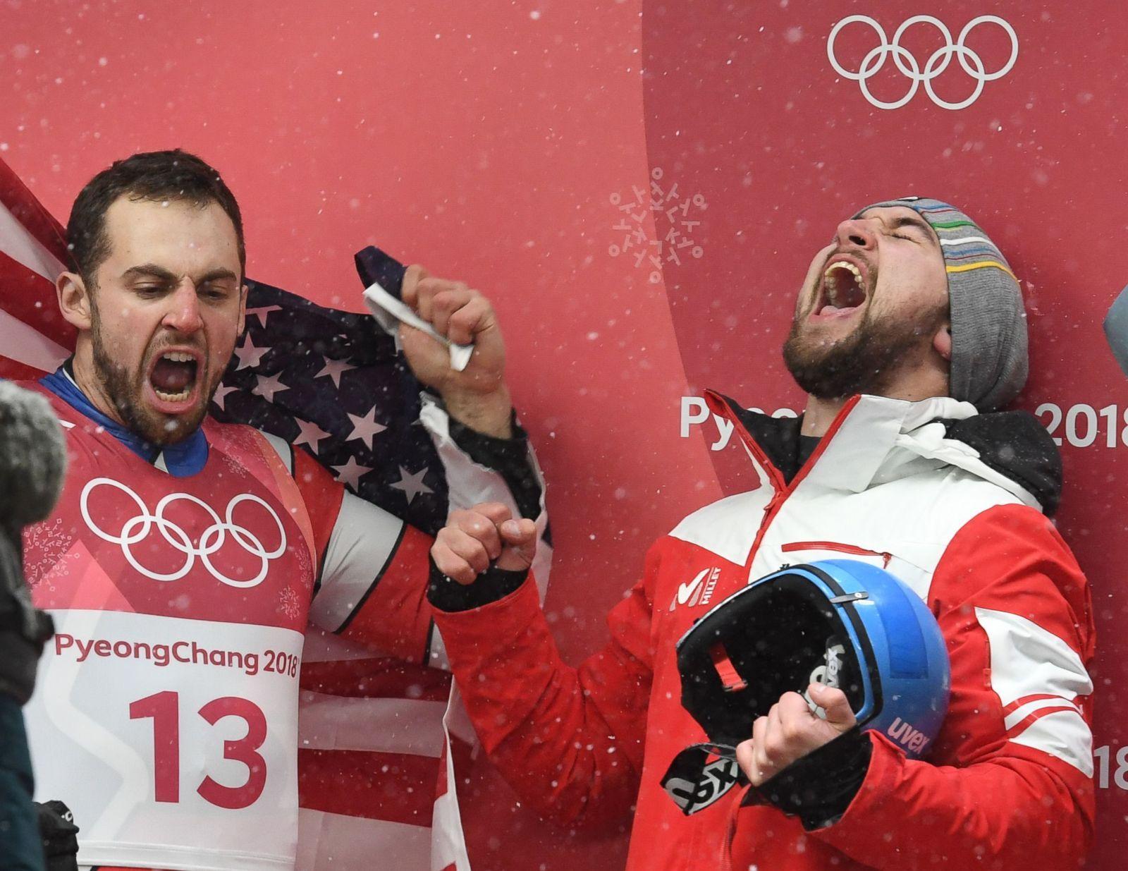 Silver medalist Chris Mazdzer, left of the USA, and gold medalist