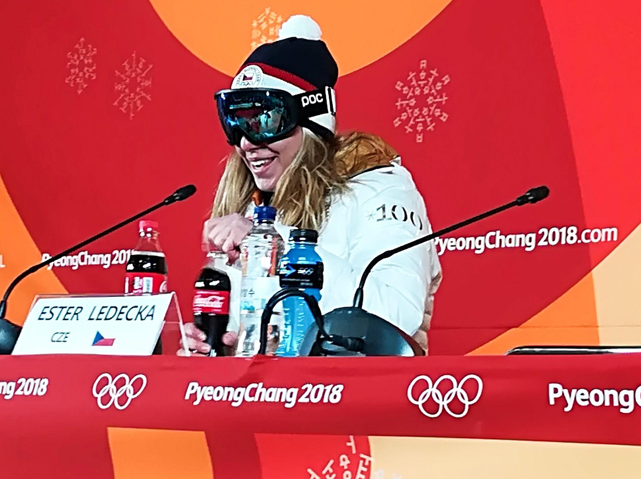 Shock Winter Olympics medalist keeps goggles on during press