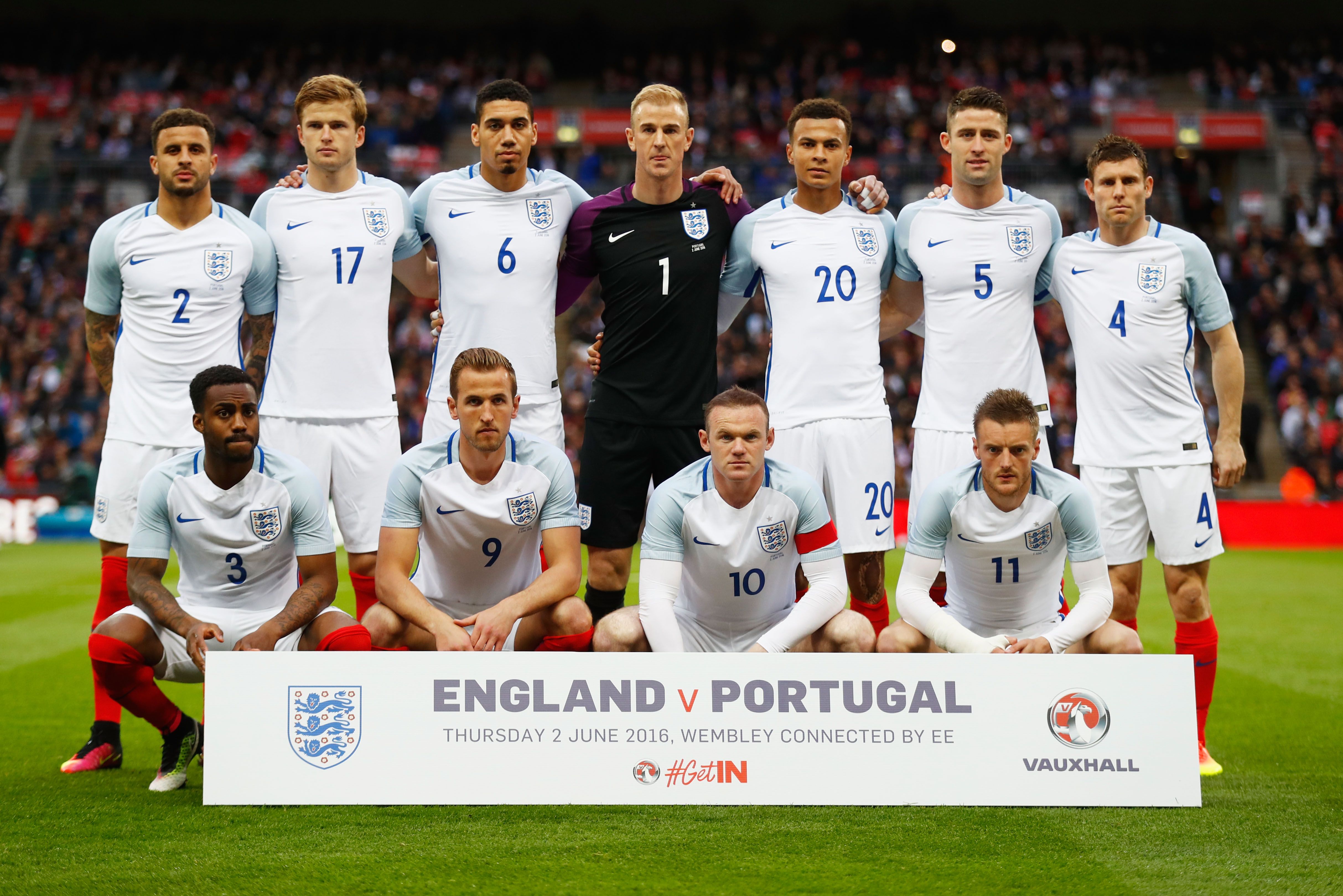  The image shows the England national football team posing for a team photo before a match against Portugal.