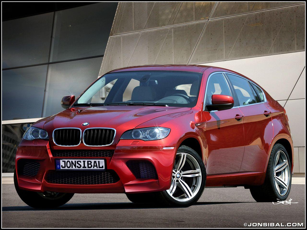 BMW X6M in metallic Ruby Red with black leather interior hmmm yes