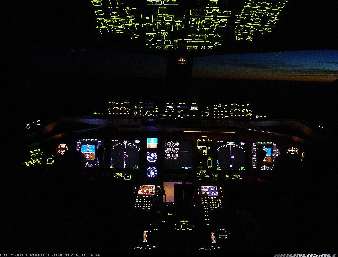 Boeing 777 cockpit, night. Aware of flight. Boeing