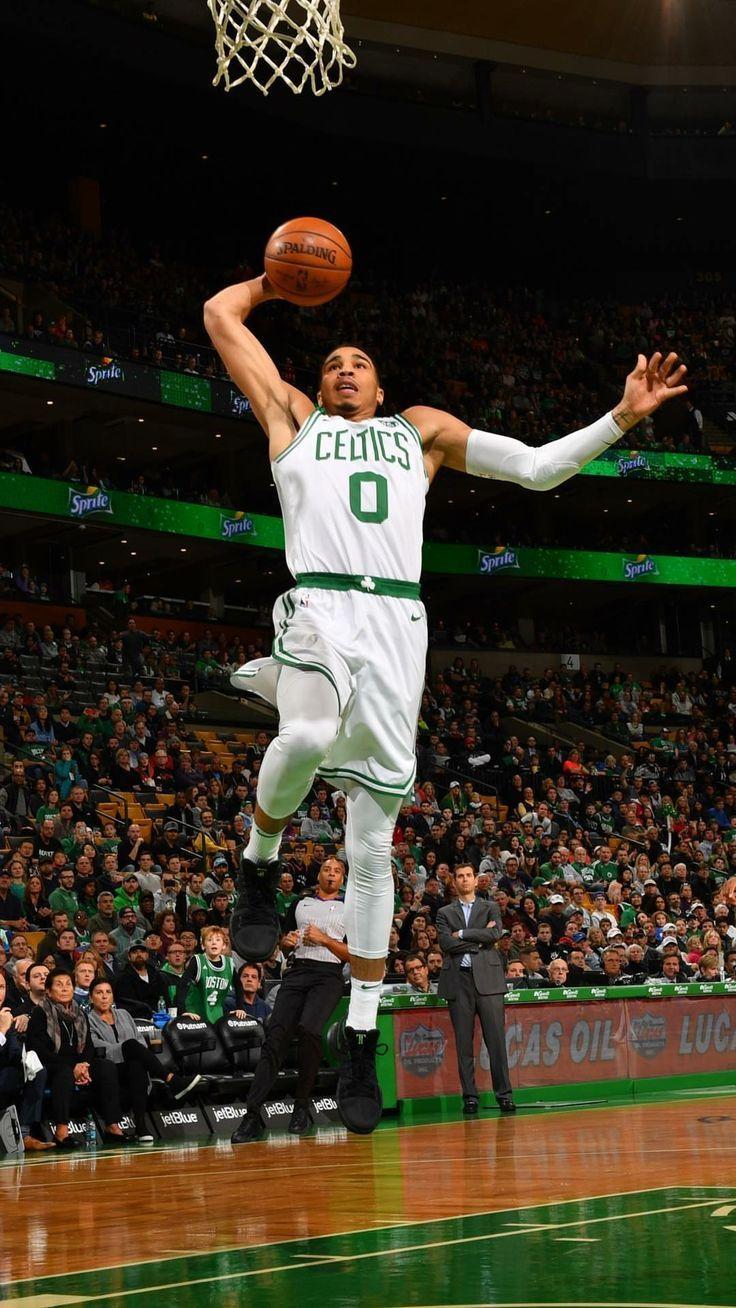 Jayson Tatum of the Boston Celtics throwing a ball into the basketball hoop  in the crowd at the stadium 2K wallpaper download