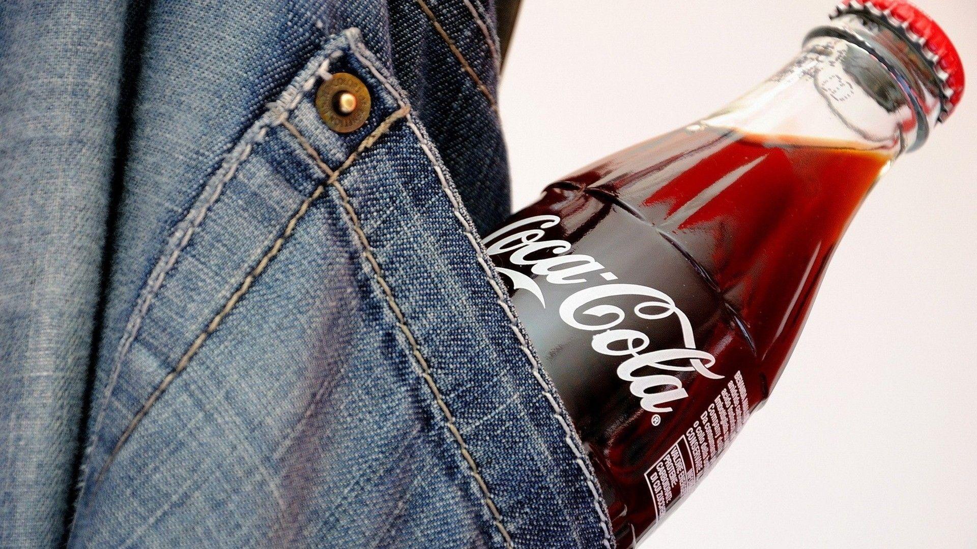 Coke bottle in the pocket of jeans wallpaper and image