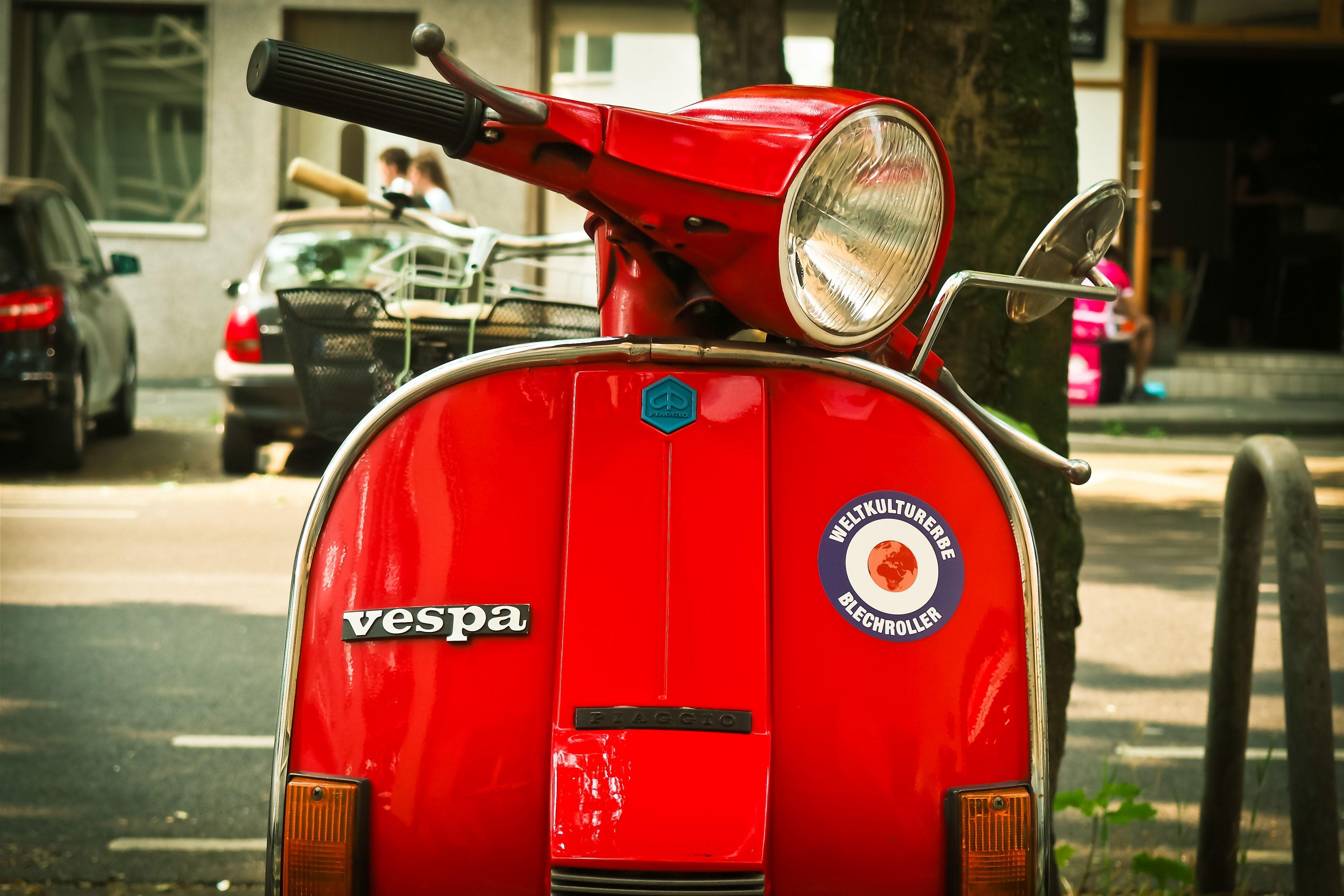 red vespa scooter free image