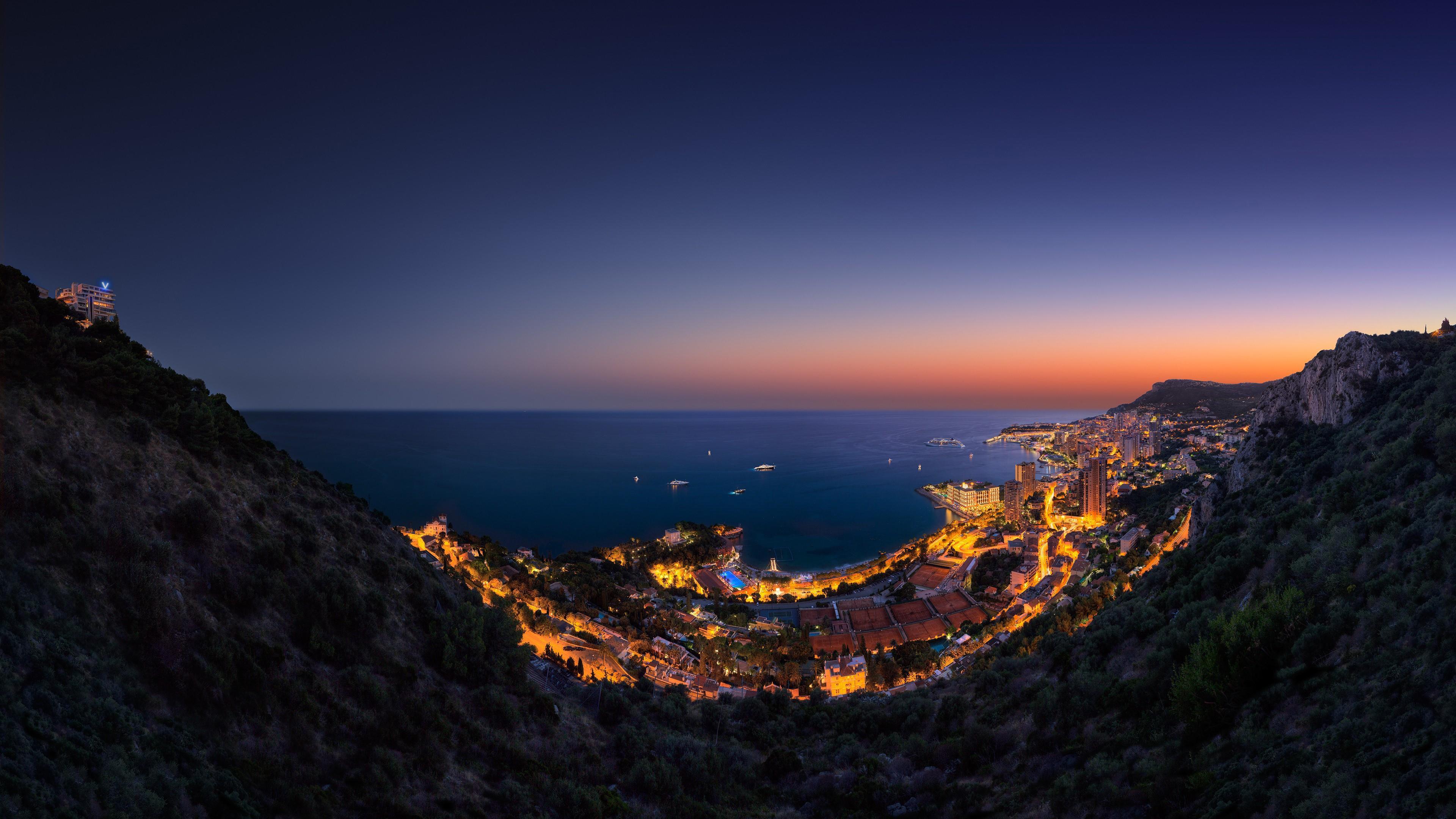 Panoramic View Of Monte Carlo, Monaco At Night Wallpaper. Wallpaper