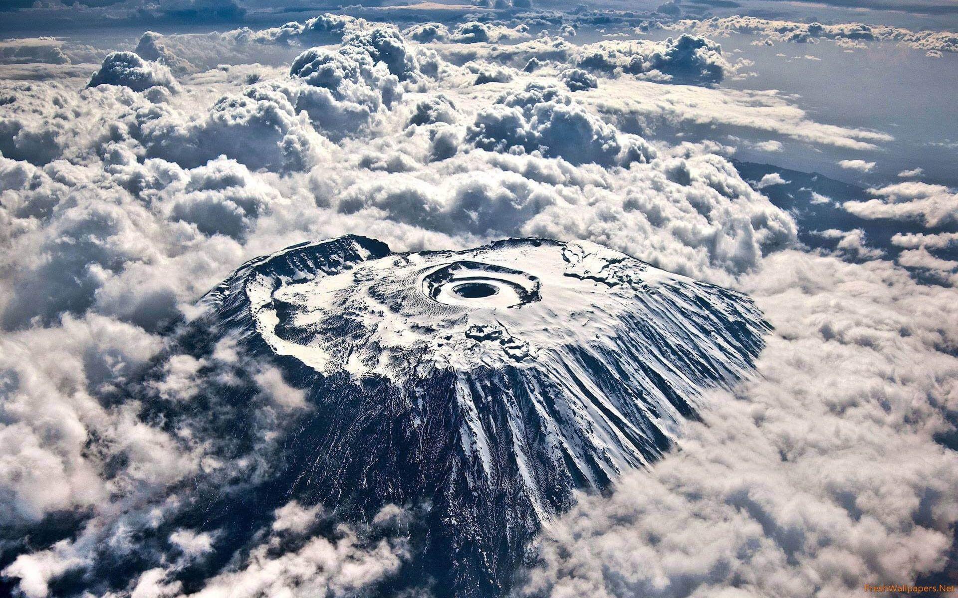 Mount Kilimanjaro Crater Over Clouds From The Air wallpaper