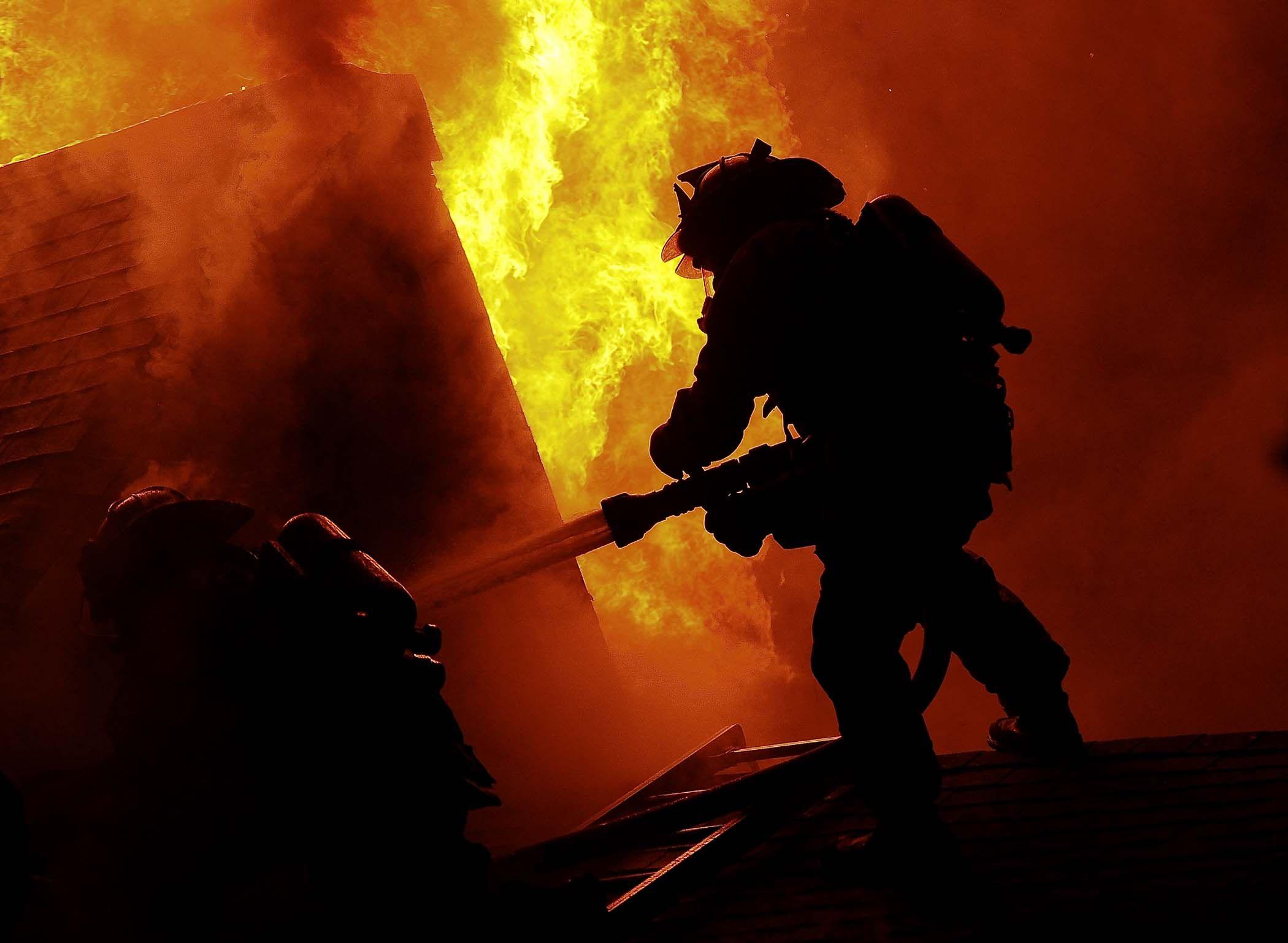 Download Fire Department Officer In A Flaming Building Wallpaper   Wallpaperscom