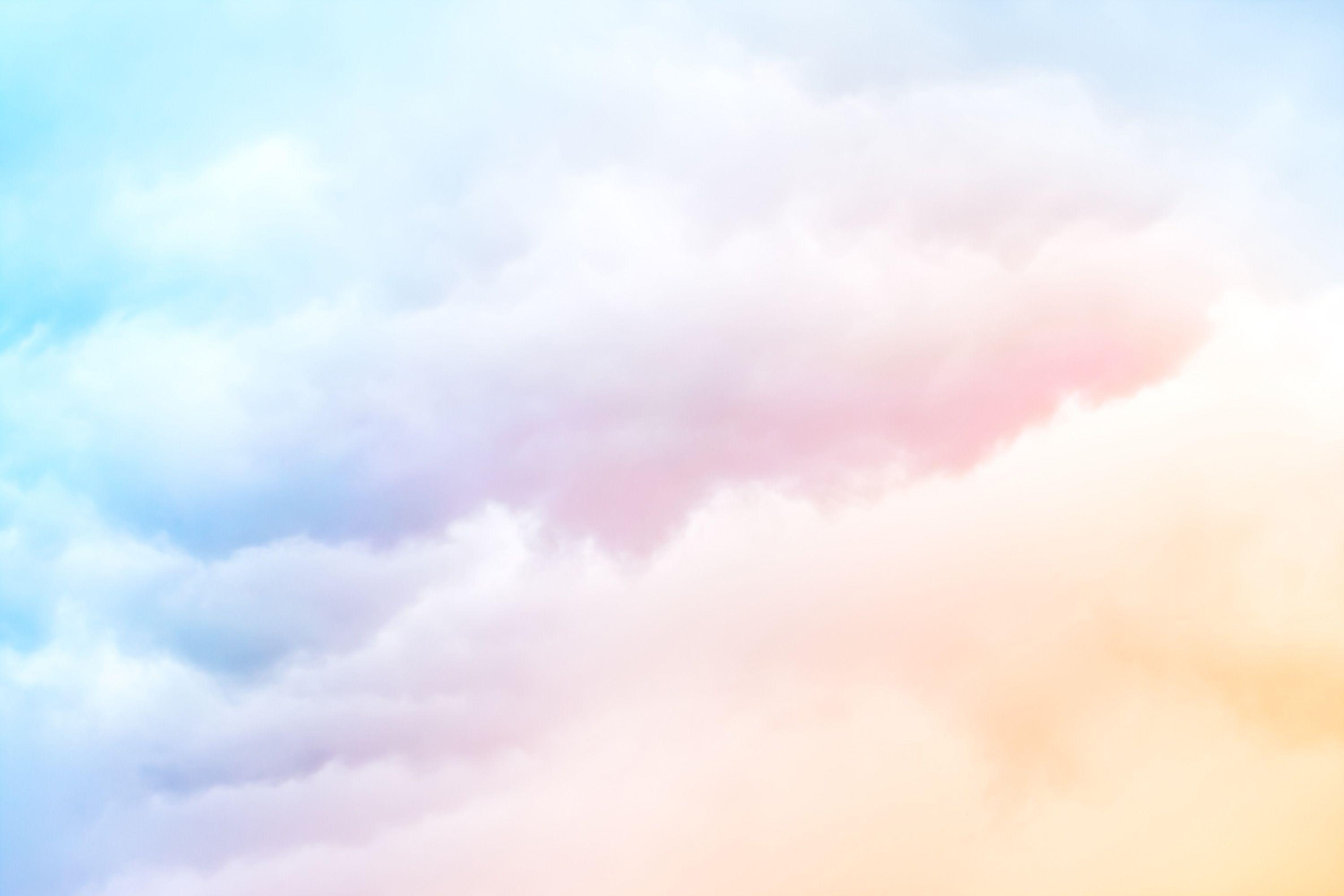 A soft cloud background with an orange pastel blue gradient