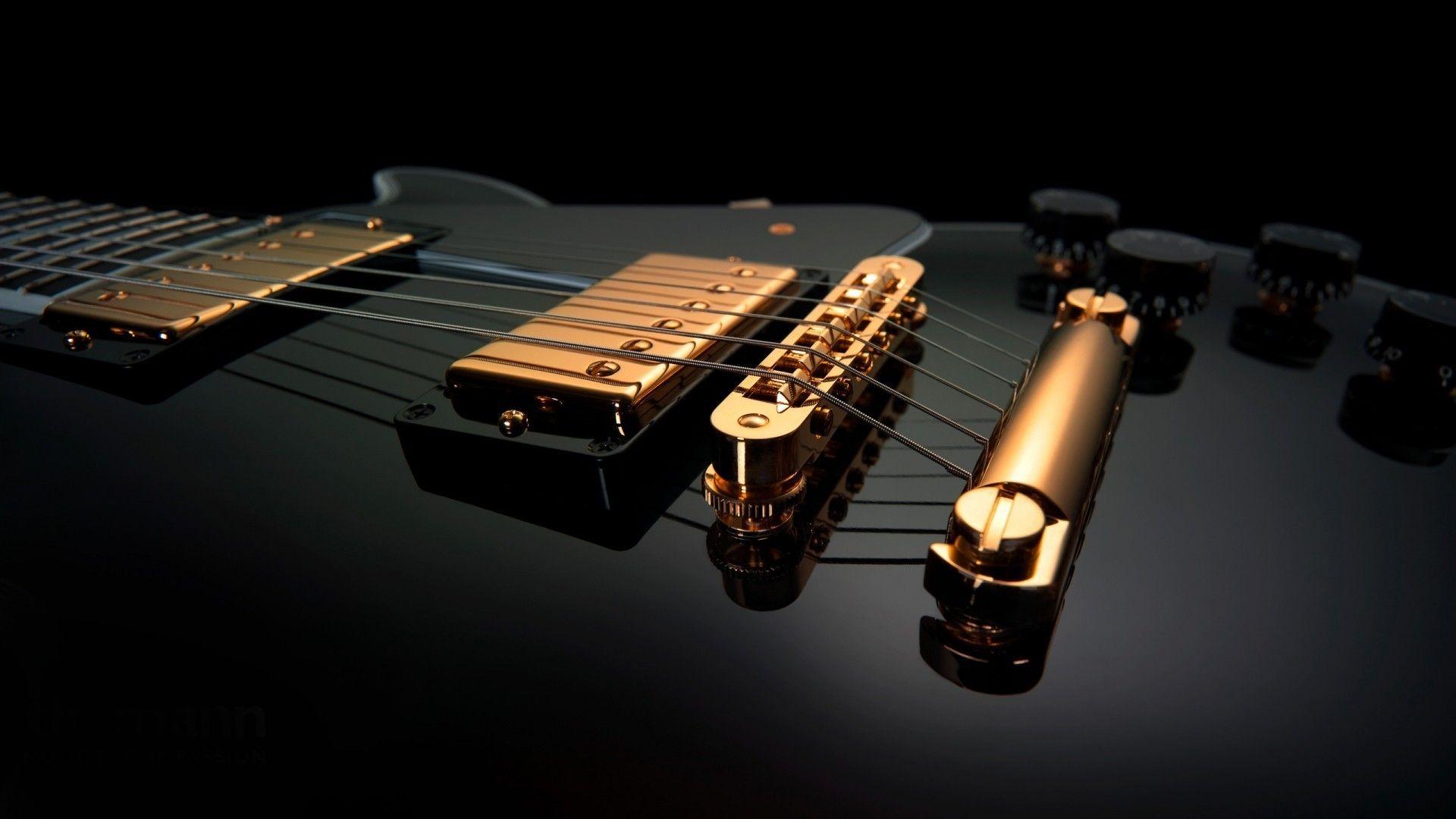 Black and gold guitars music wallpaper. PC