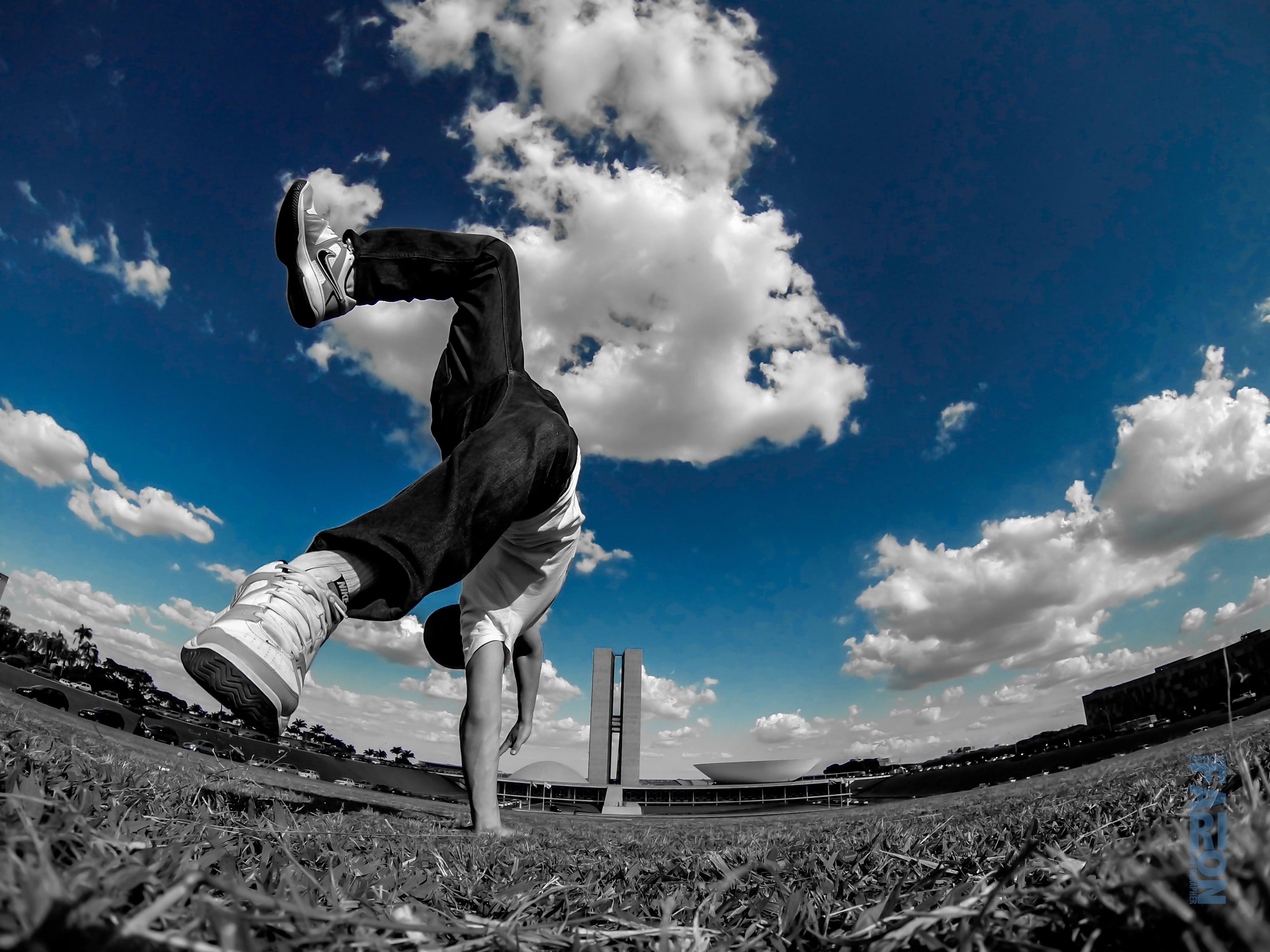 Fisheye lens photography of male doing stunt during daytime HD