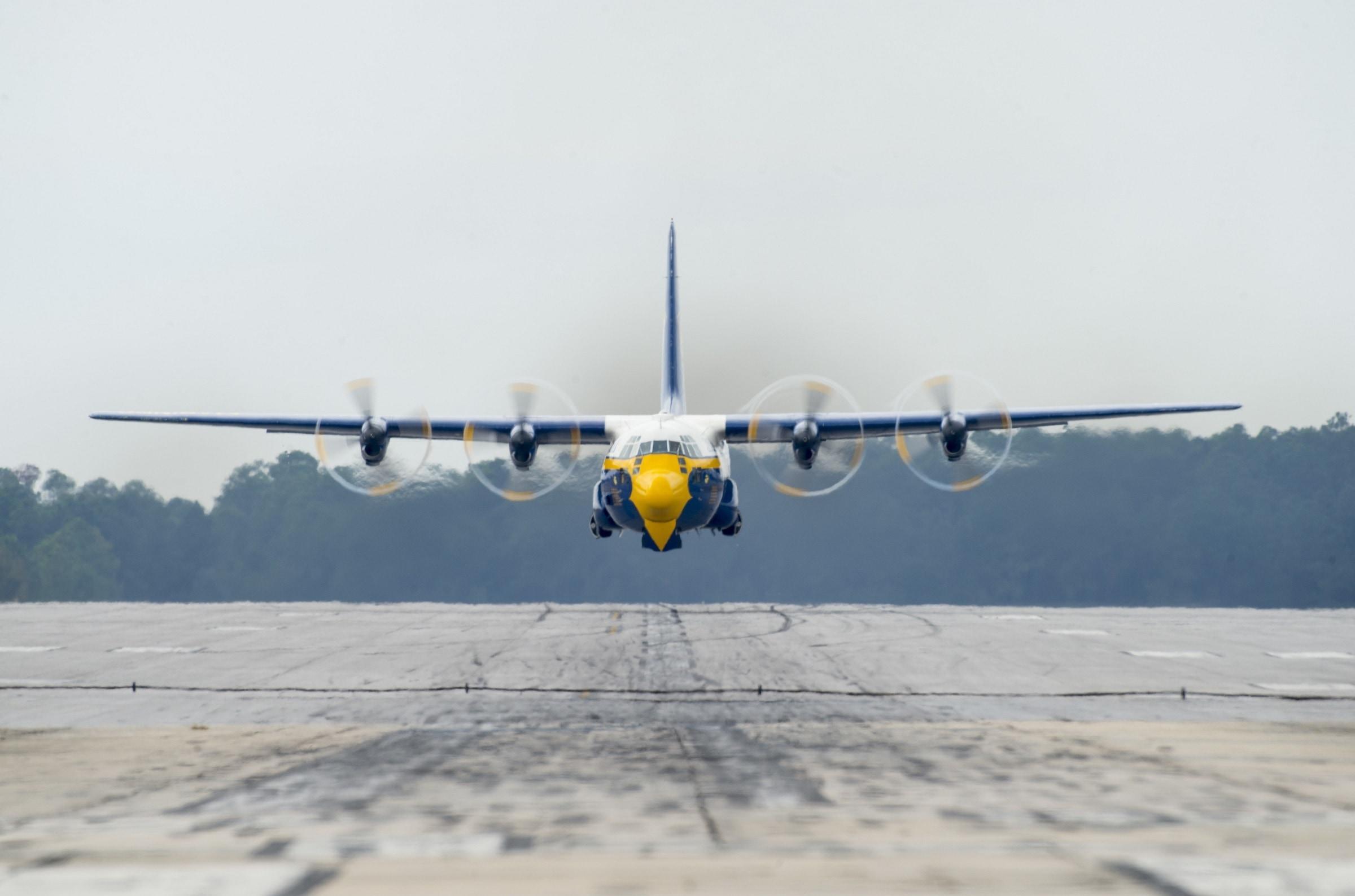 white yellow and blue c 130 plane free image