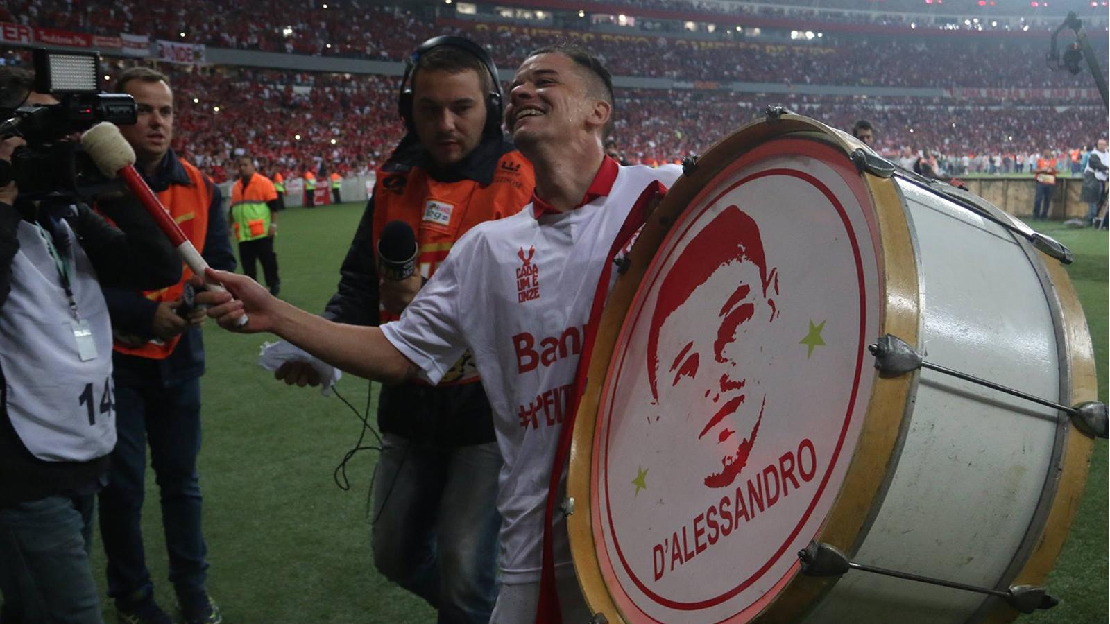 Andrés D'Alessandro celebrating with fans' instruments as