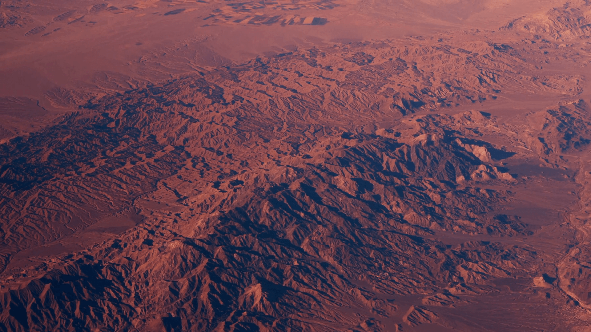 Flight above desert Rub al Khali at Saudi Arabia. Red sands and blue