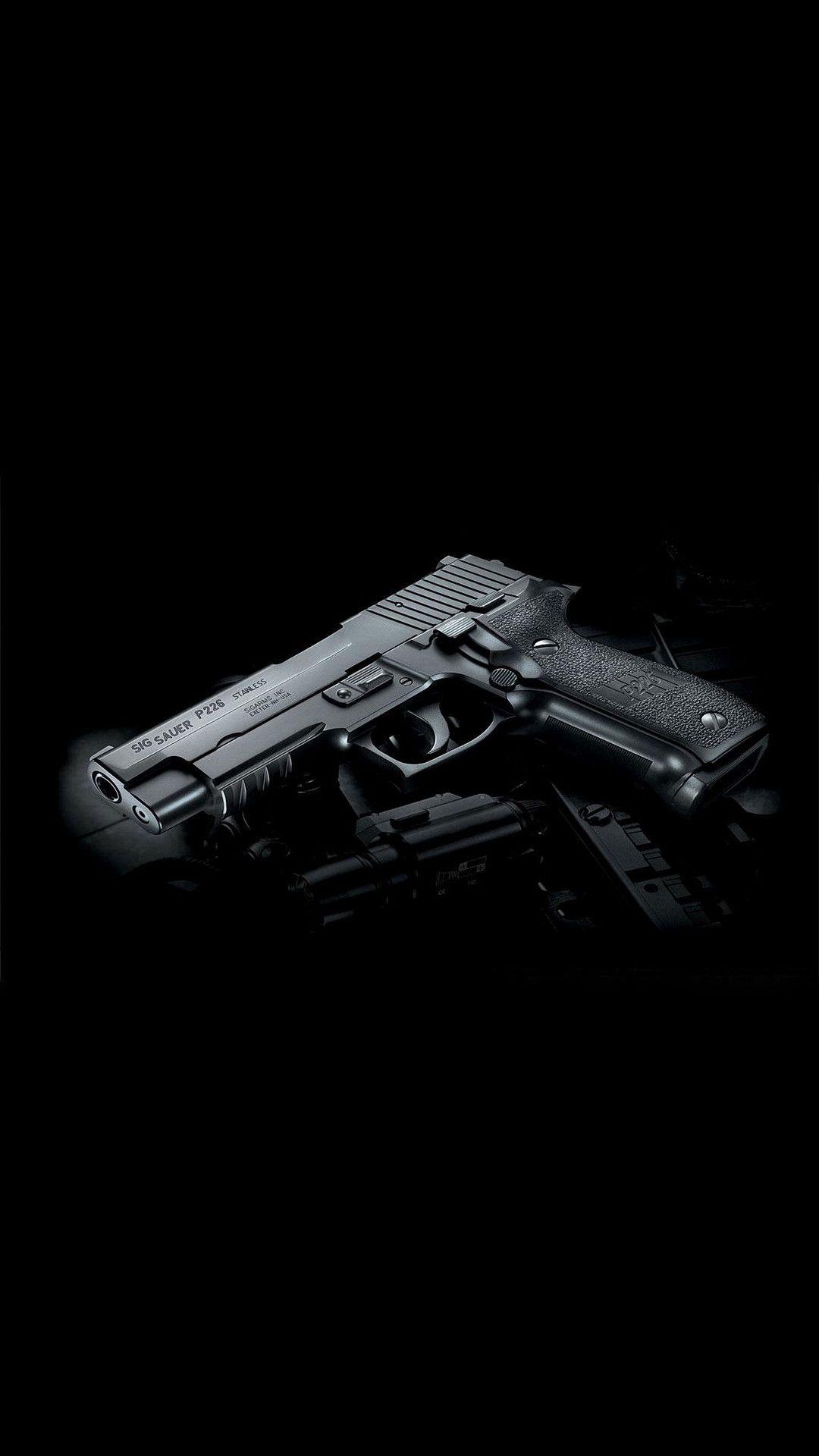 Revolver Gun Dark Background iPhone wallpaper