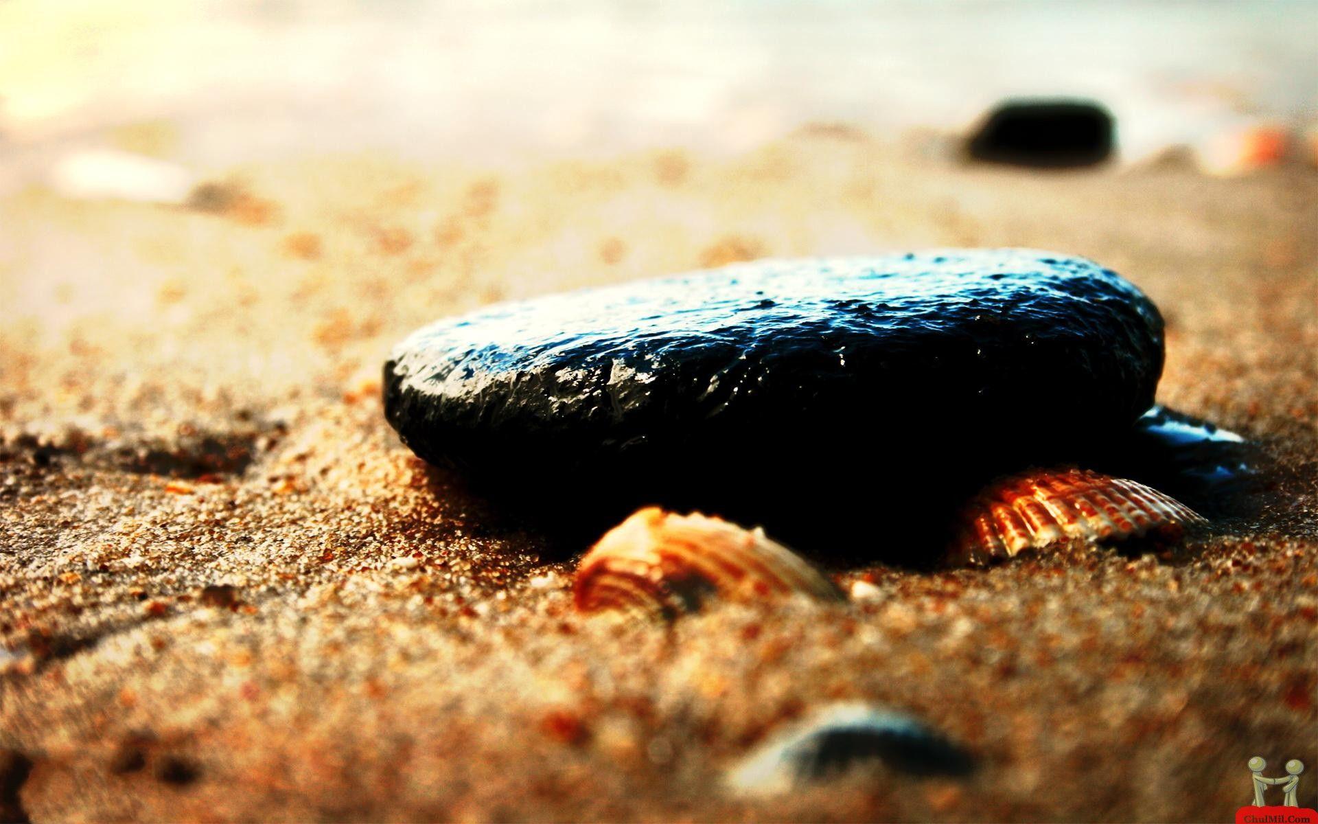 Black Stones In The Beach