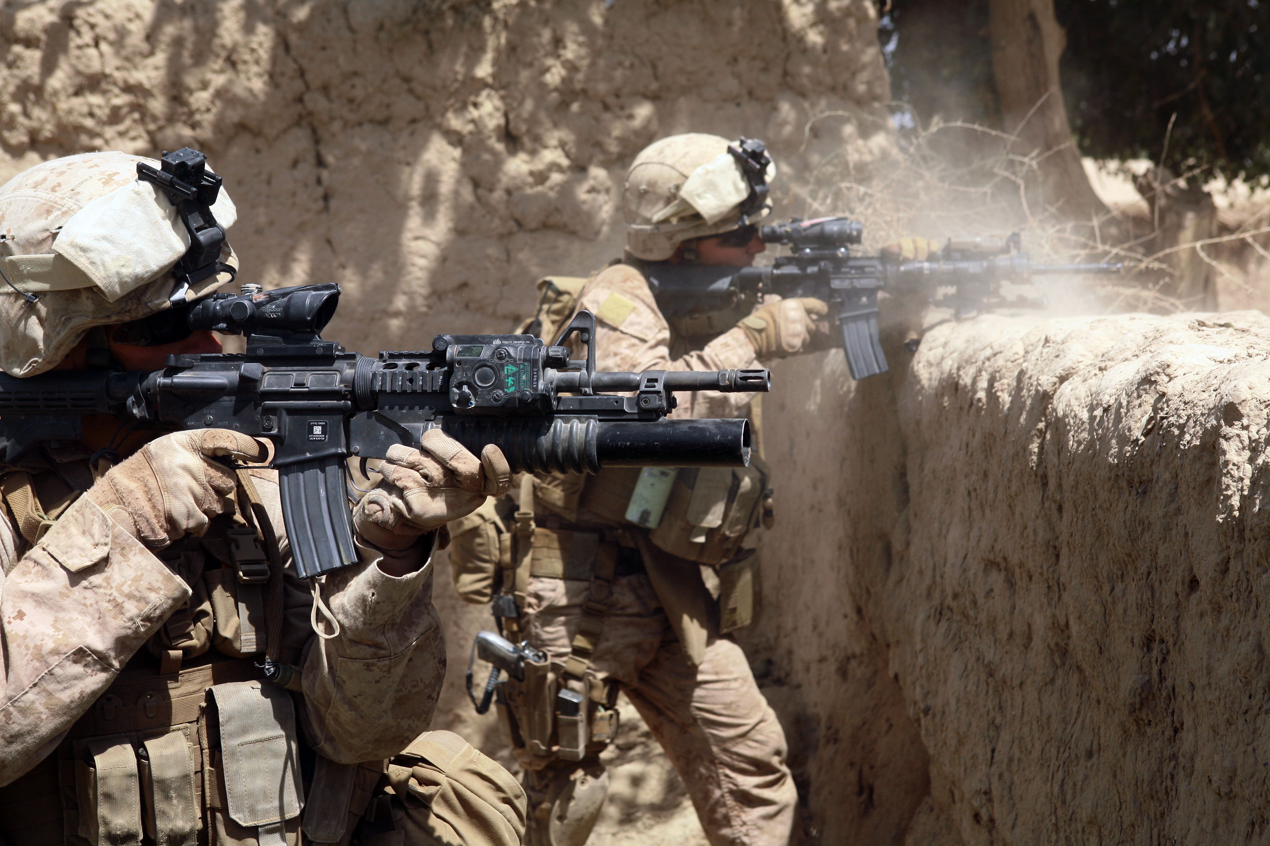 US Marines firing M4s in Helmand province