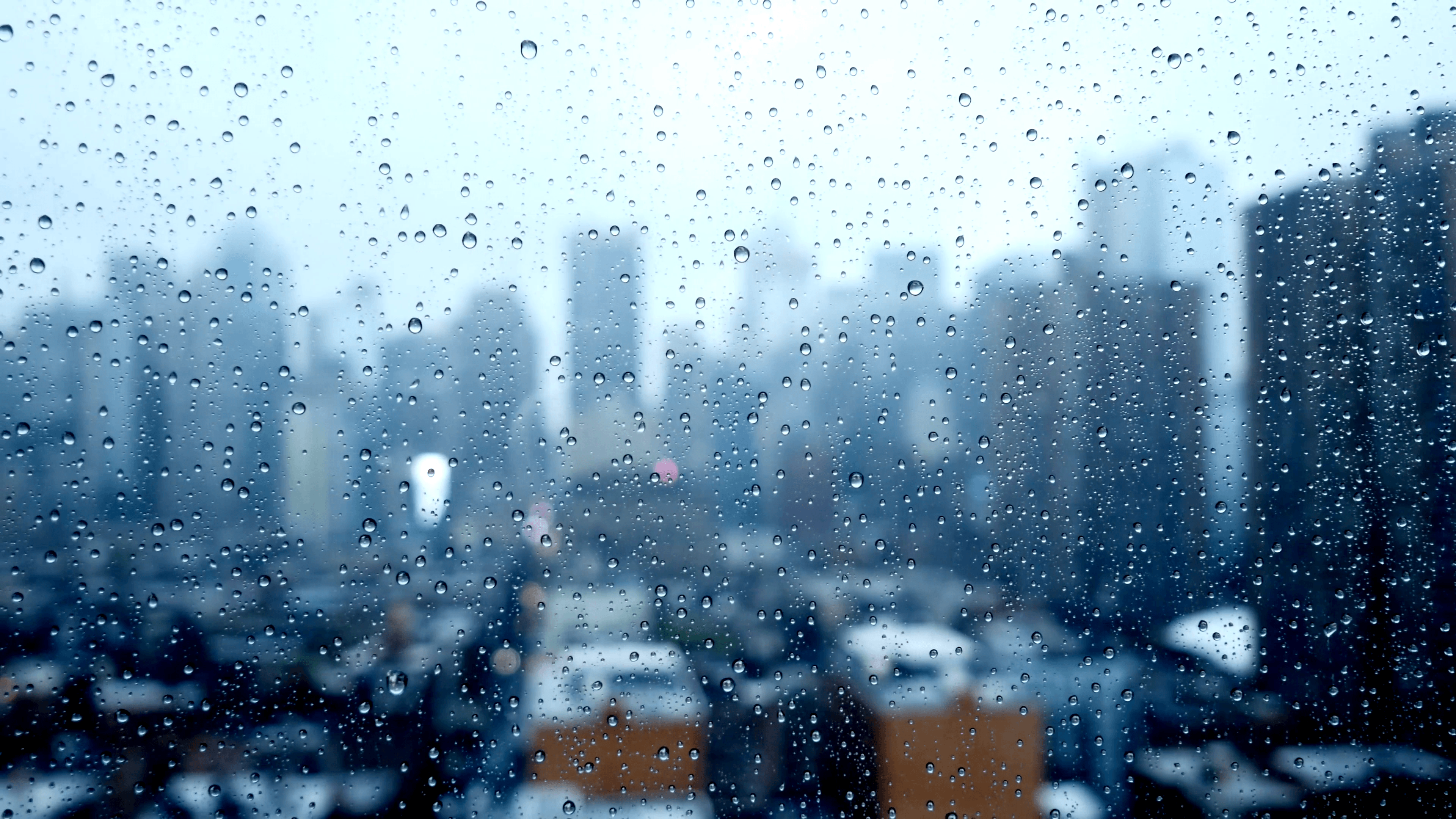 city skyline background on a rainy wet weather day. sad mood
