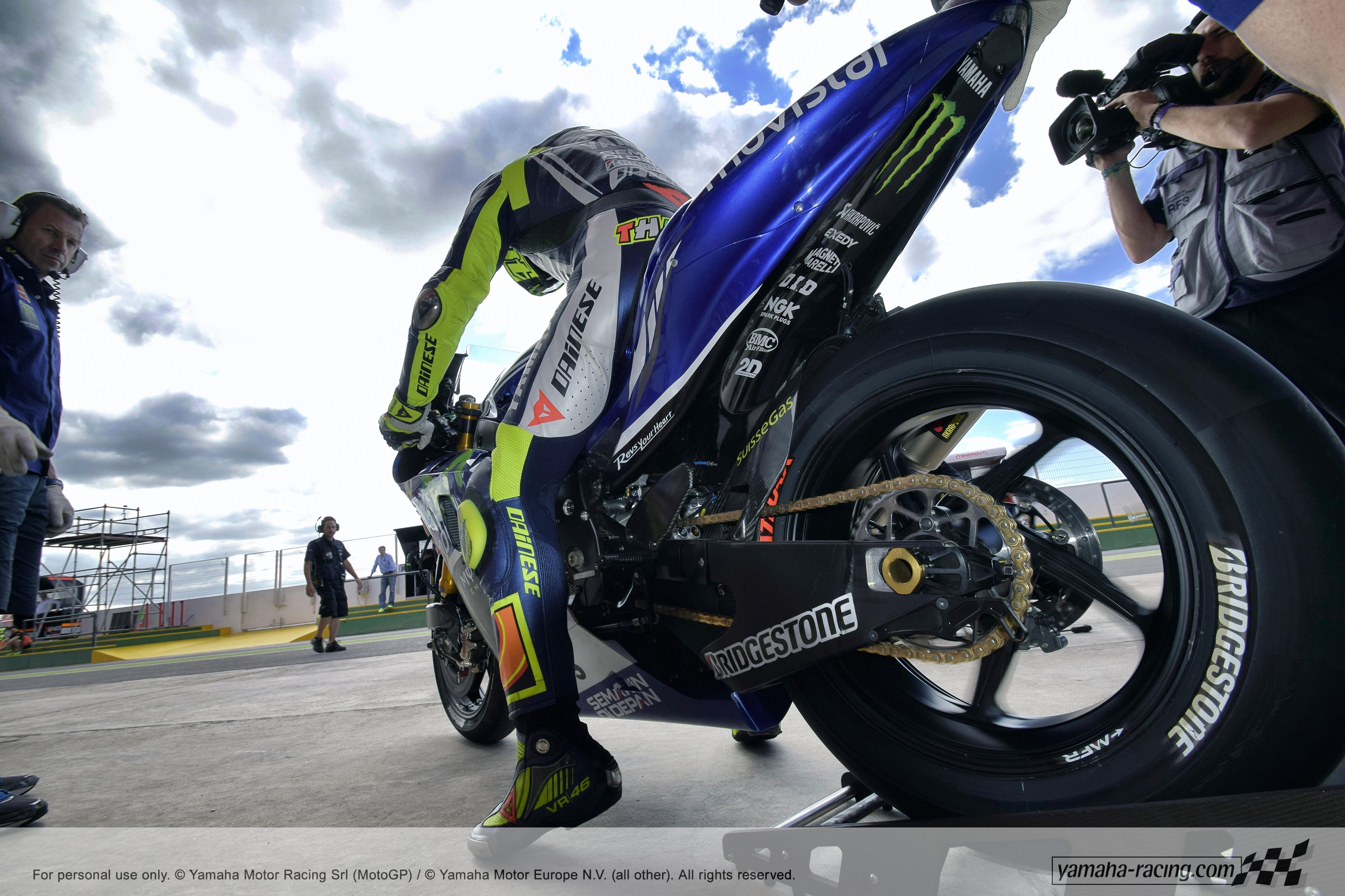 Valentino Rossi on a sports motorcycle wallpaper and image
